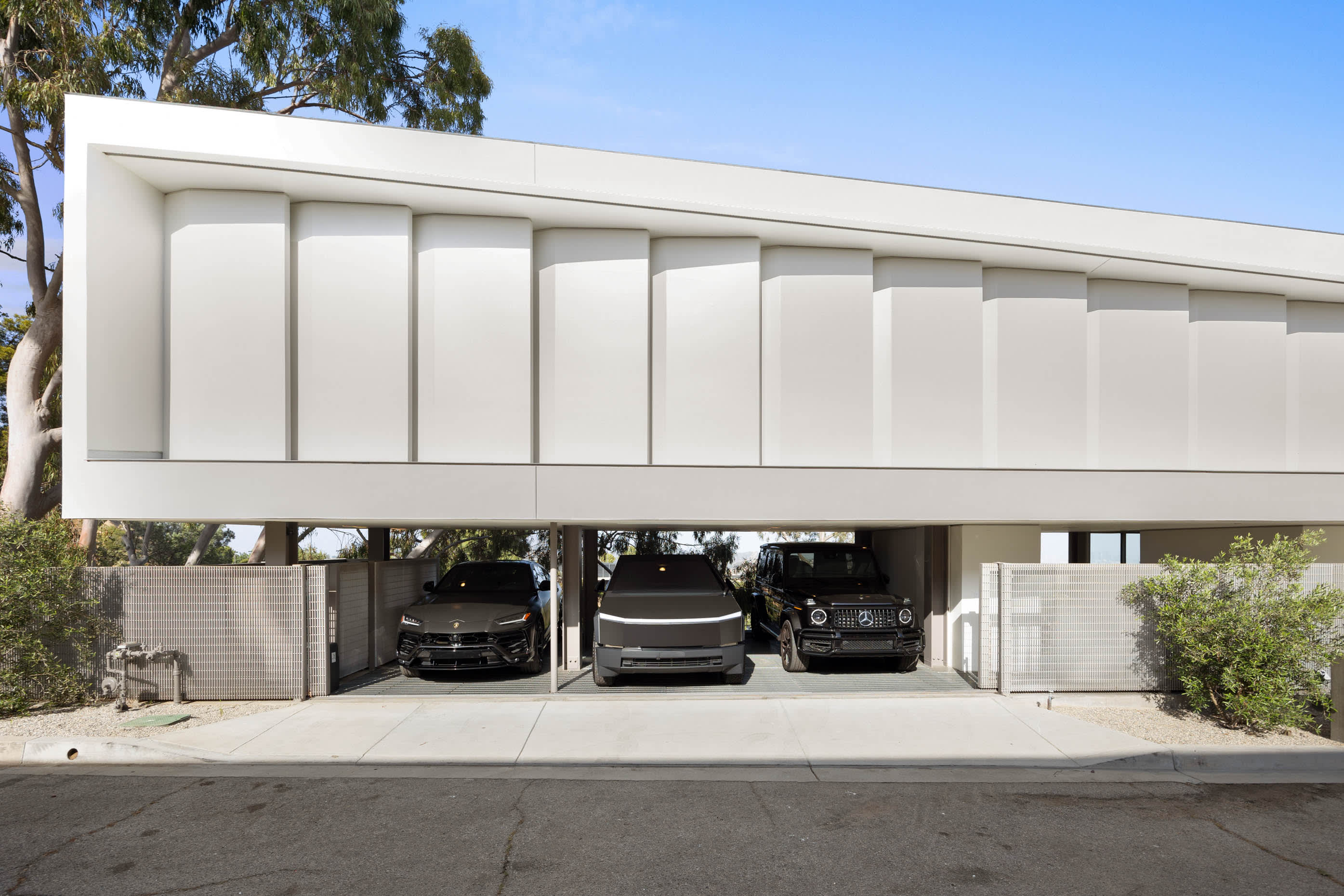 Exclusive 3-car carport offering secure and convenient parking for luxury vehicles.