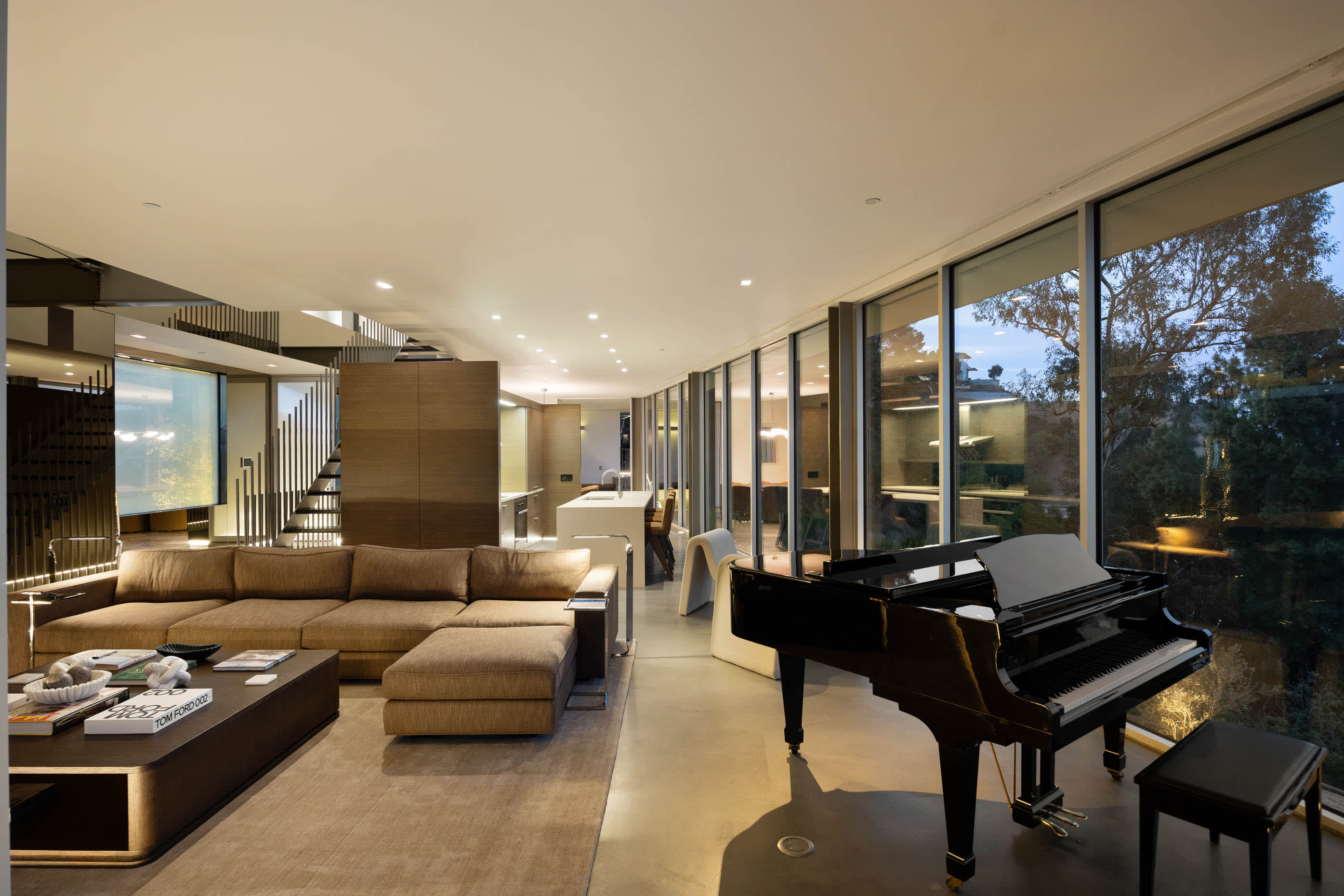 Living area adorned with a grand piano, epitomizing elegance and musical sophistication.