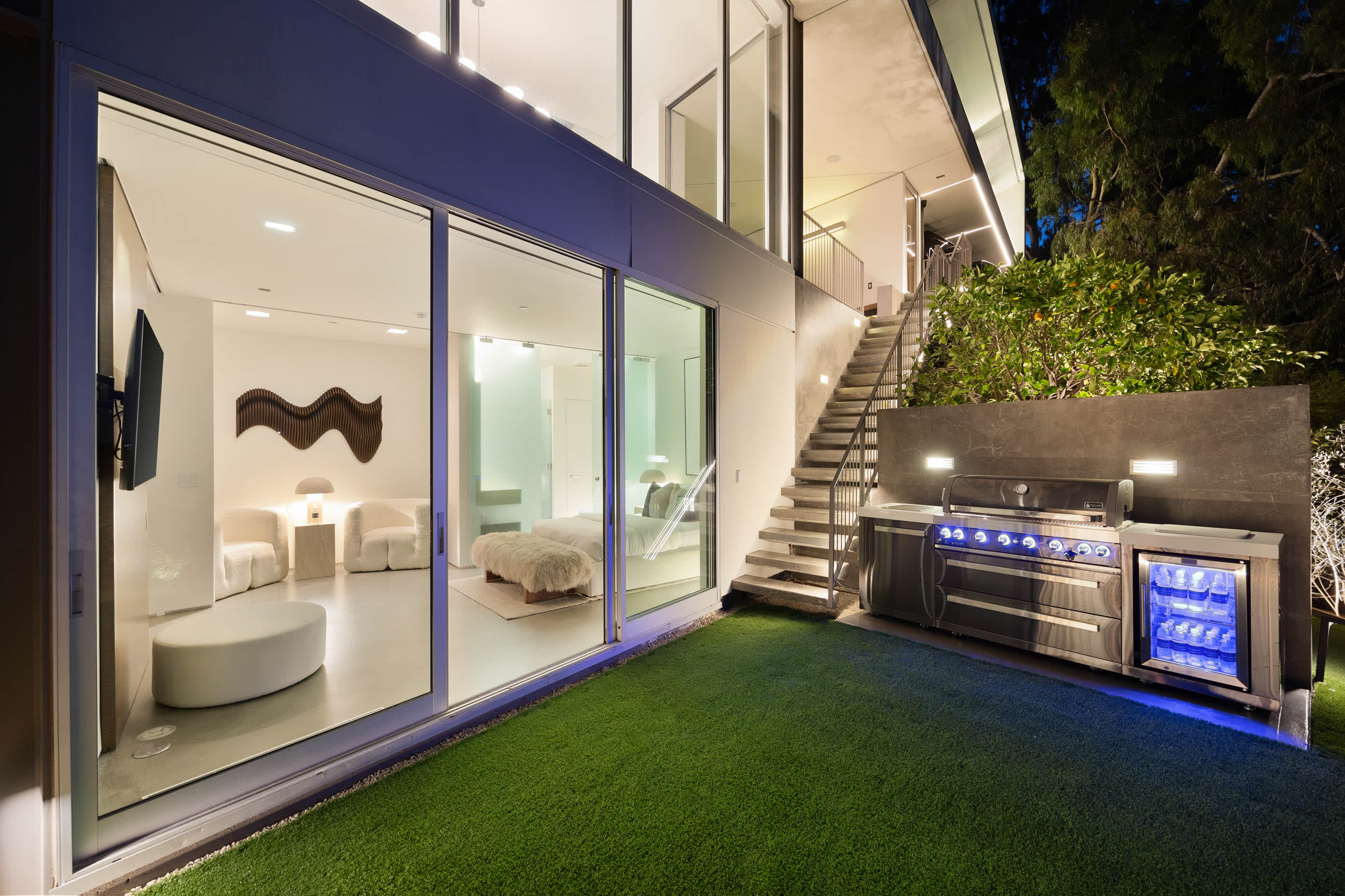 State-of-the-art BBQ station with built-in mini fridge, perfect for gourmet outdoor cooking.