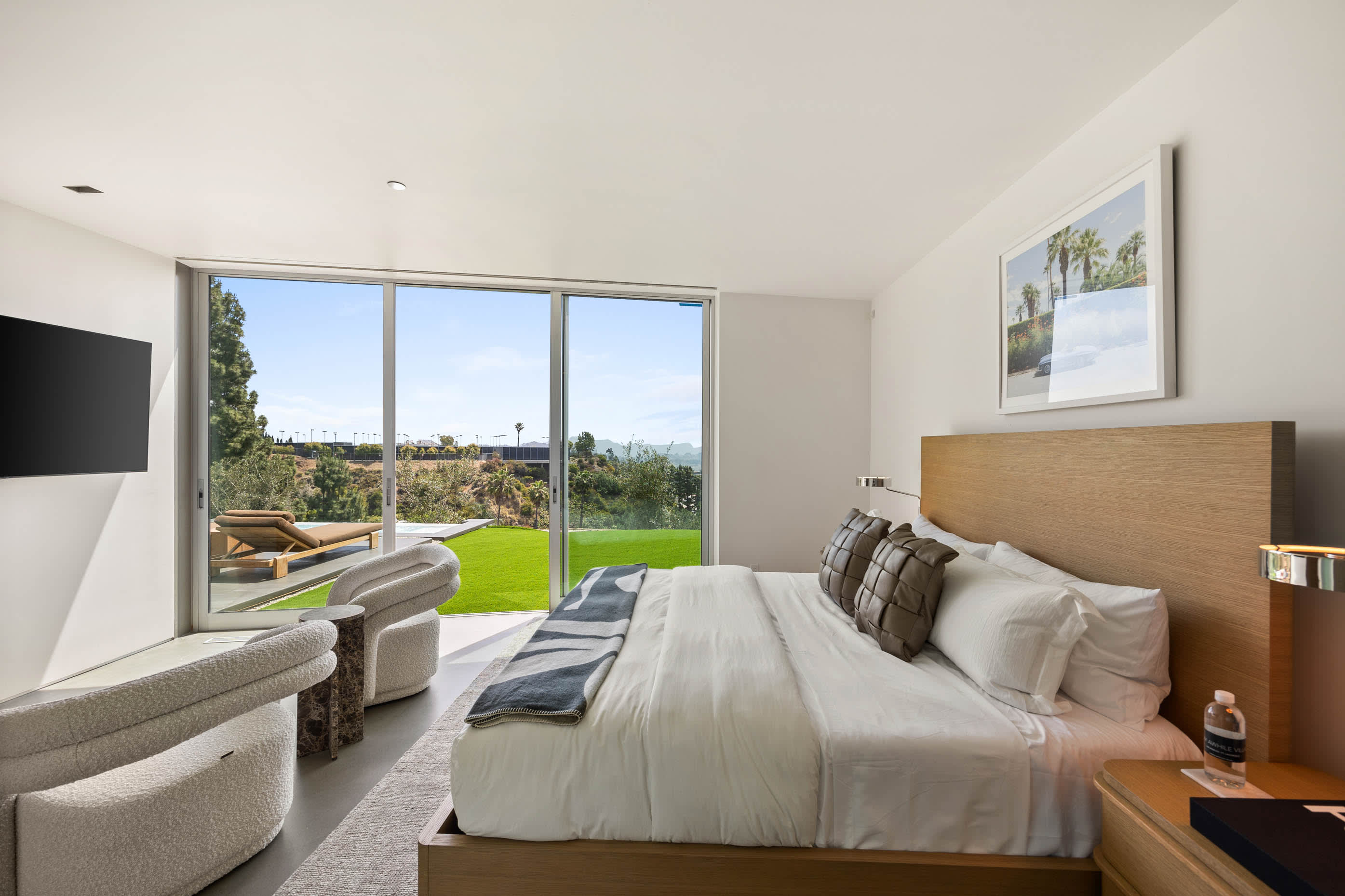 Luxurious bedding and refined decor create an atmosphere of pure elegance and comfort.