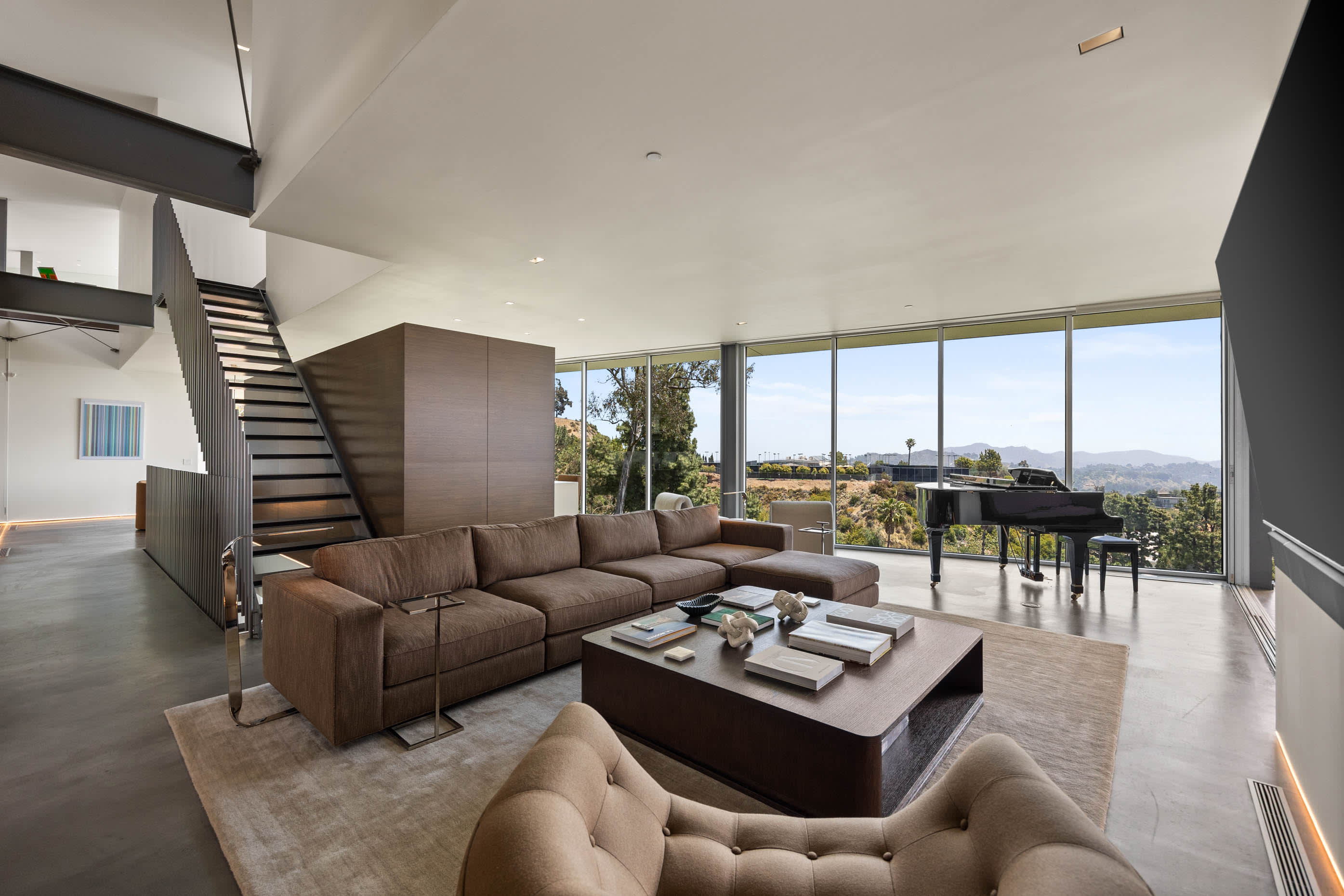 Spacious living area with stylish furniture and ample natural light.