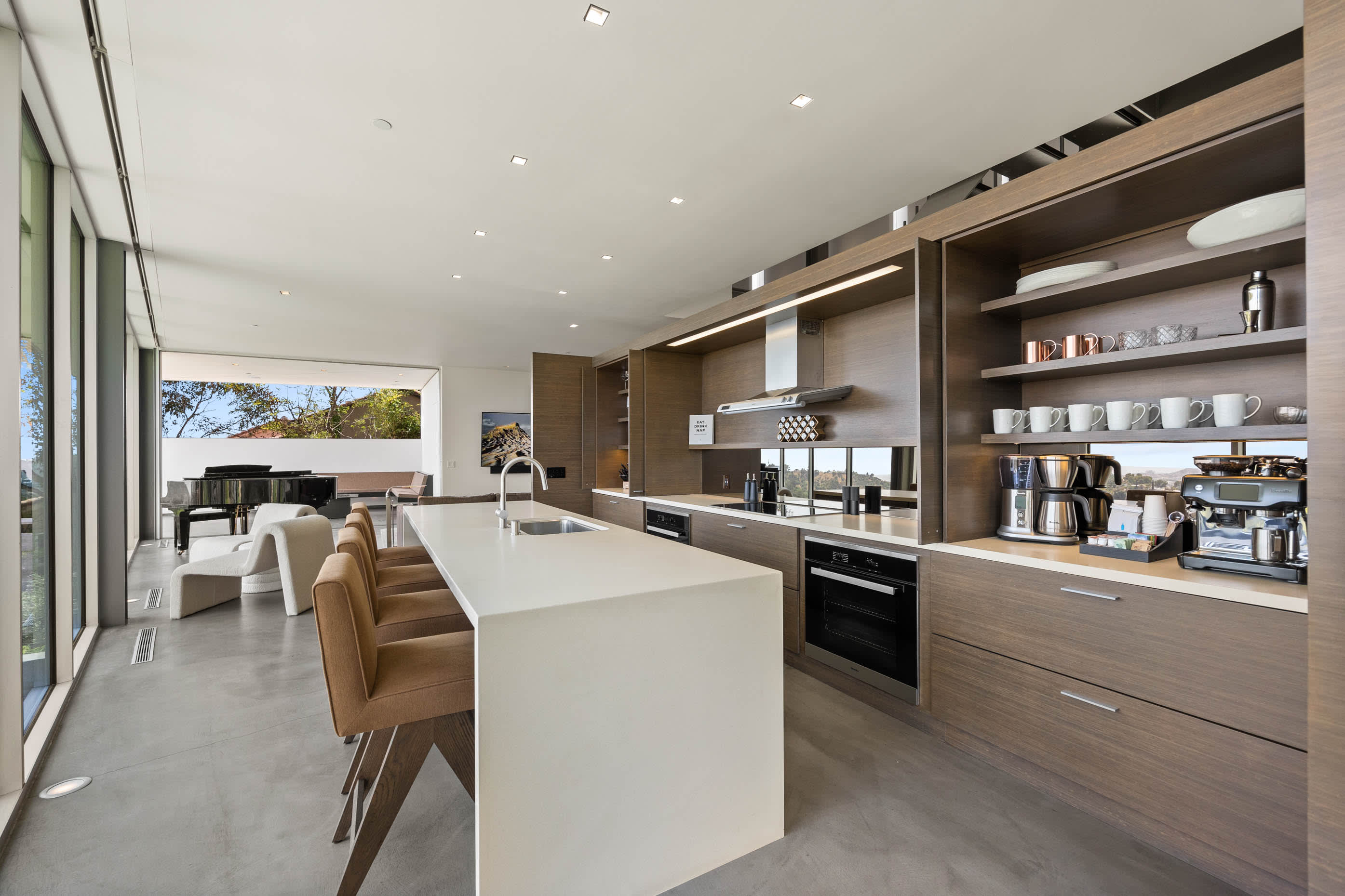 Contemporary kitchen with upscale finishes including a Sub-Zero refrigerator and Wolf range, designed for culinary mastery.