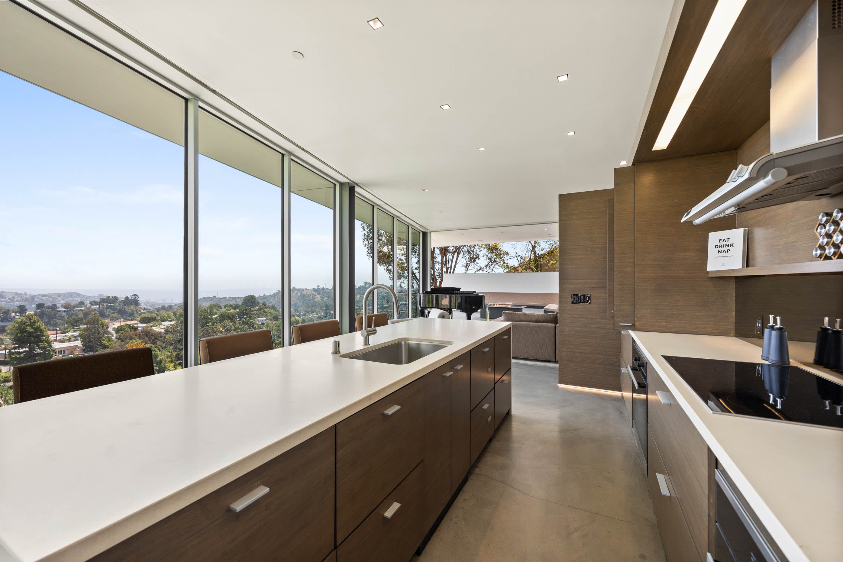 Absolutely stunning daytime views from the kitchen showcase serene natural landscapes seamlessly blending with the vibrant cityscape.