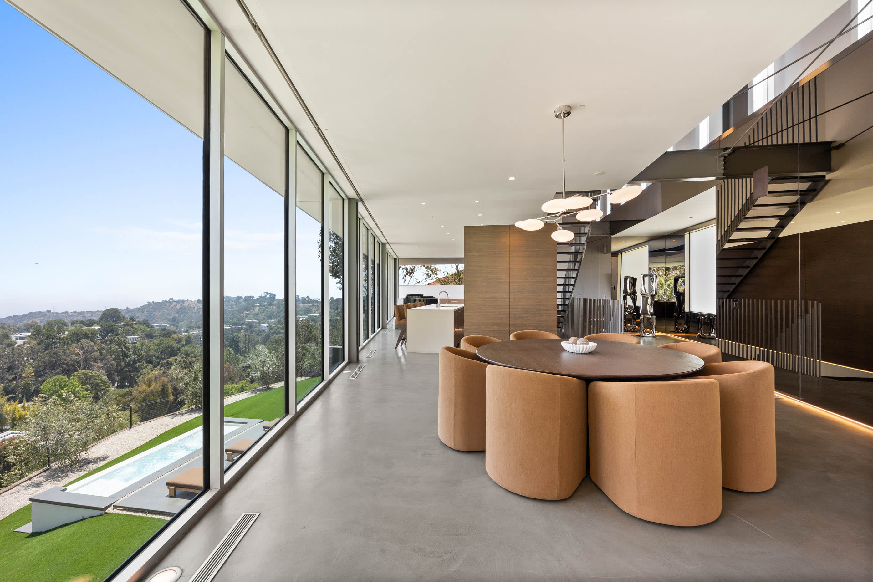 The dining area comfortably accommodates eight guests, offering a picturesque view of surrounding natural beauty.