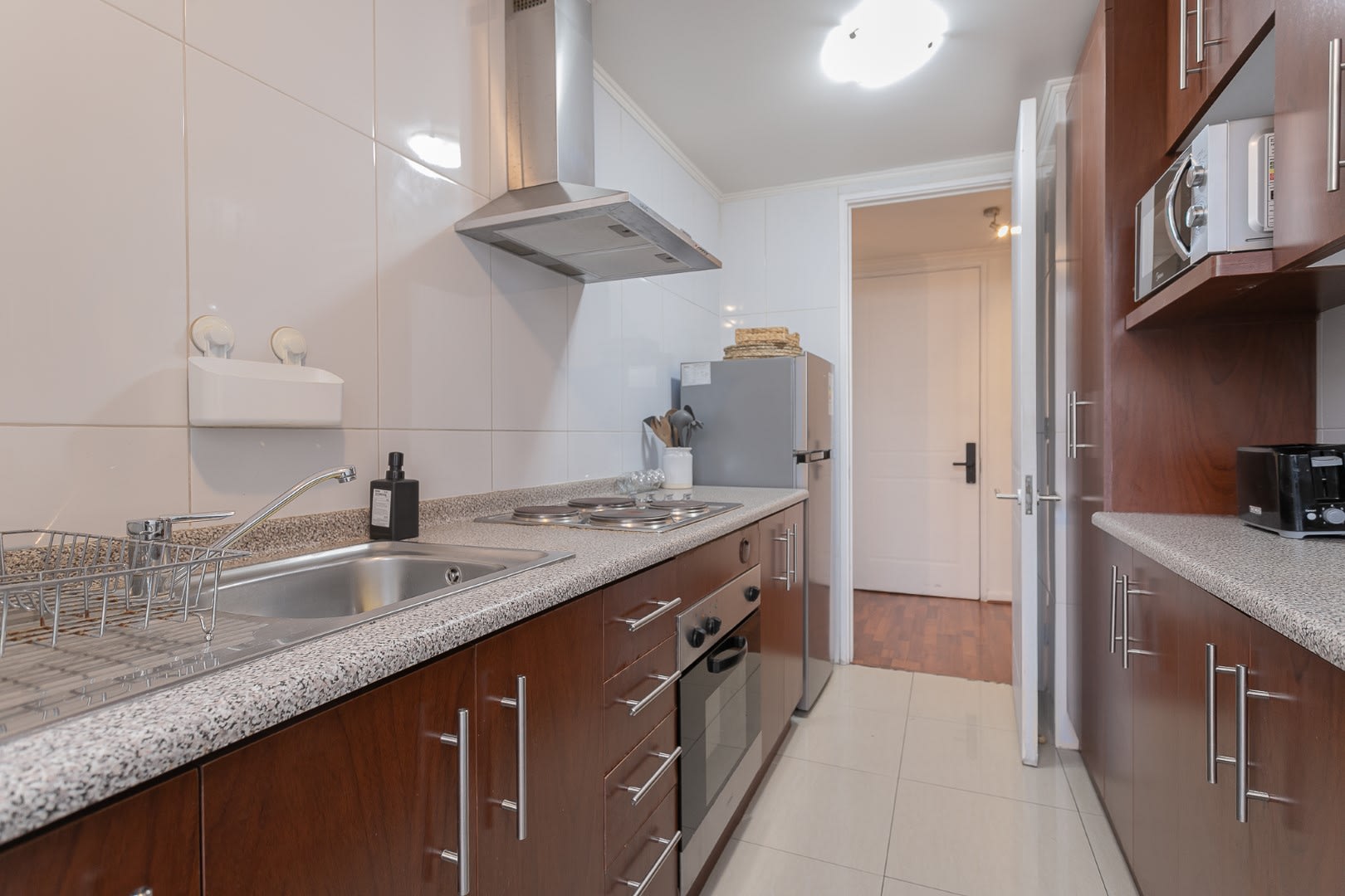 Modern kitchen with sleek appliances and ample counter space for culinary adventures.