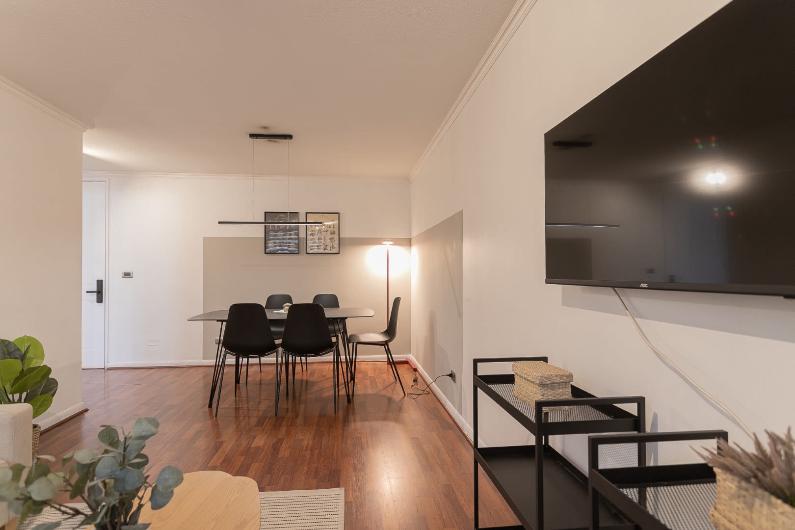 Modern dining area perfect for gatherings, featuring sleek furniture and a cozy ambiance.