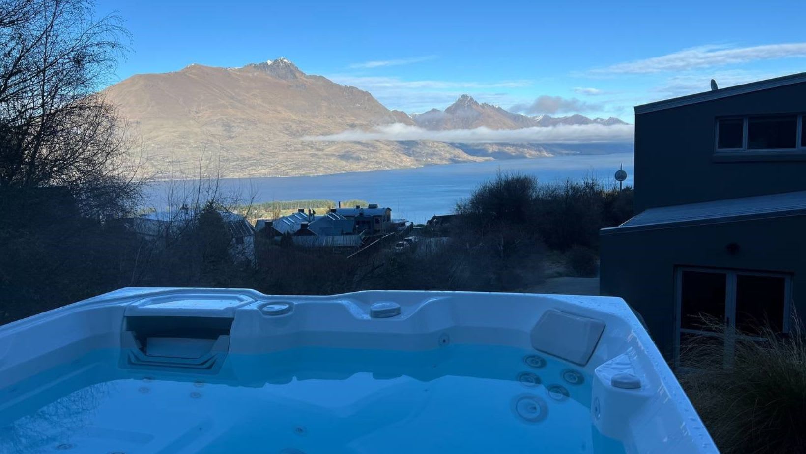 Enjoying stunning views from your Queenstown accommodation with spa