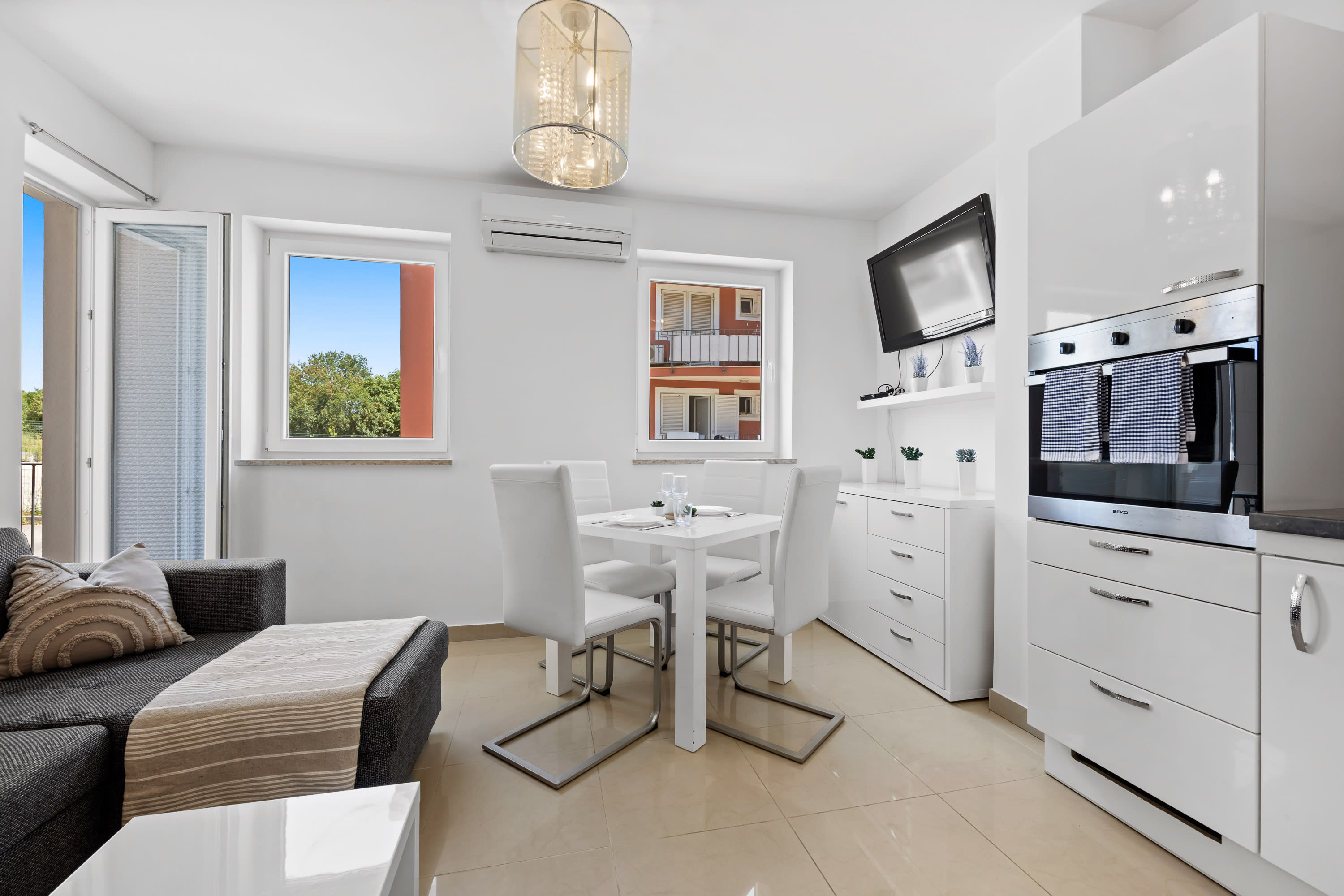 Charming White Apartment with Balcony and Parking - Photo 1