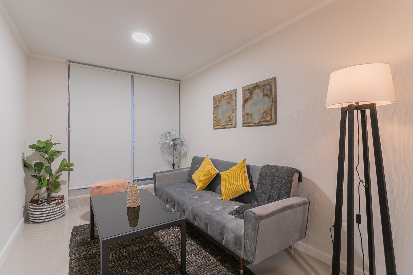 Cozy living room with stylish decor and inviting ambiance, perfect for relaxation in the heart of Santiago.