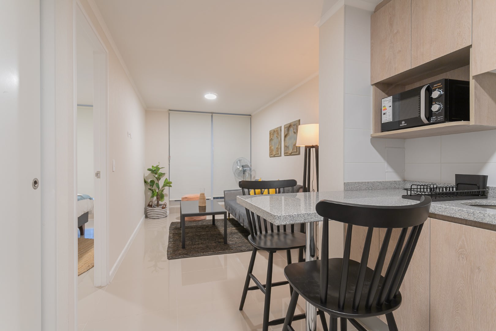 Experience modern living with a fully equipped kitchen and cozy living space, perfect for your stay in Chile.