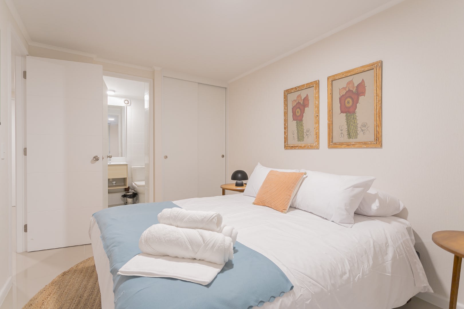 Relax in this cozy bedroom with soft lighting and stylish decor, perfect for a restful stay in the heart of Chile.