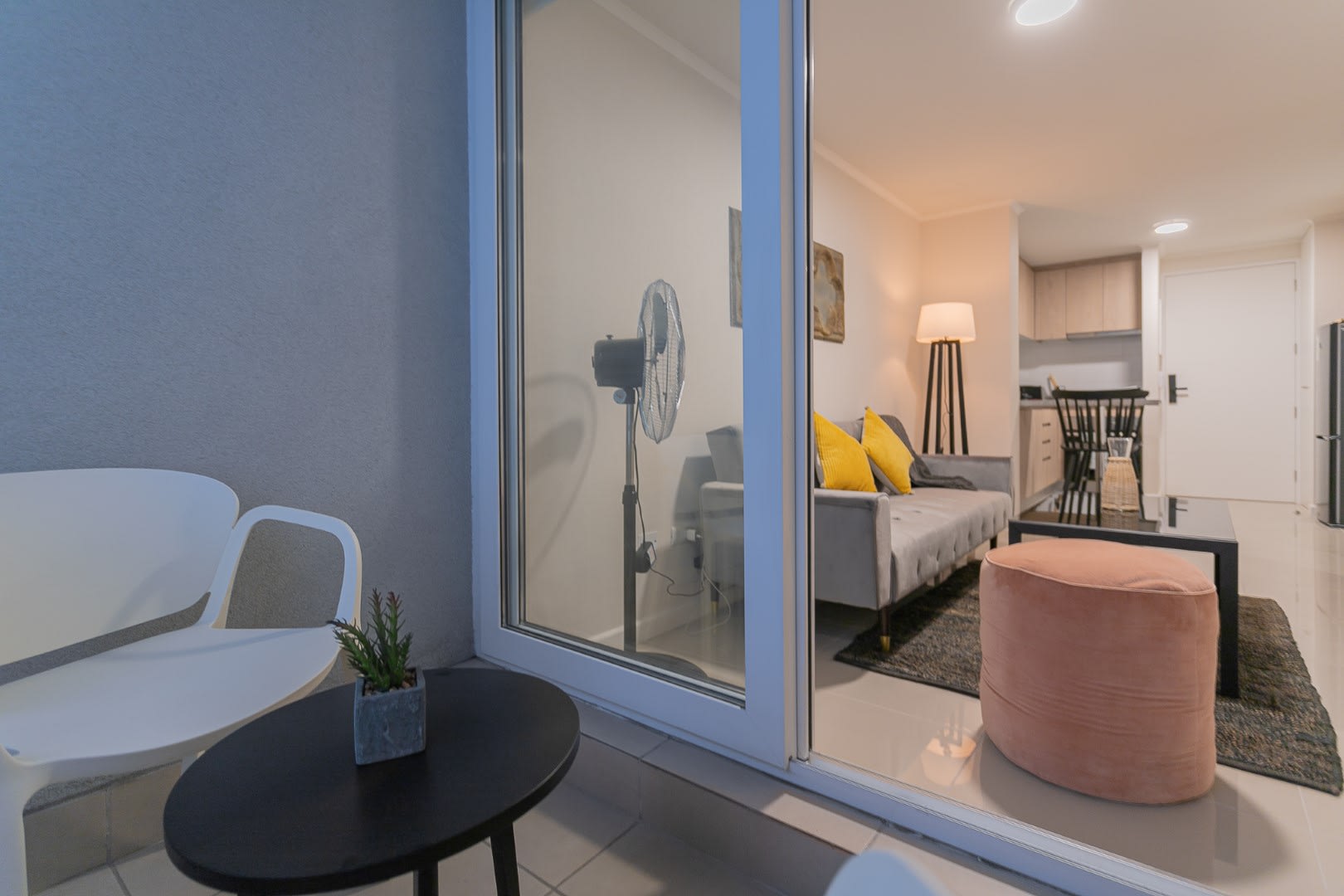 Cozy patio retreat with stylish seating, perfect for relaxing evenings.