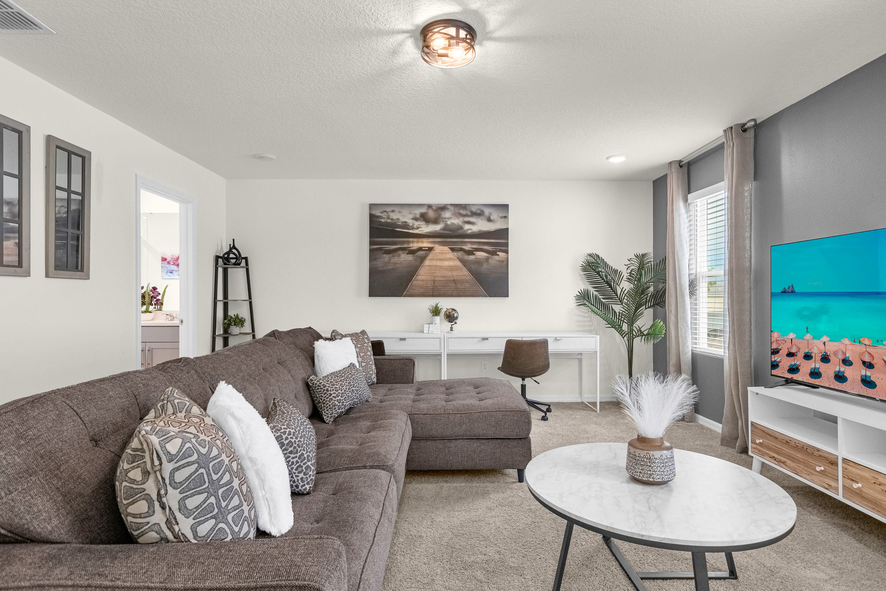 TV Lounge and Office Space with Dedicated Laptop-Friendly Workstation