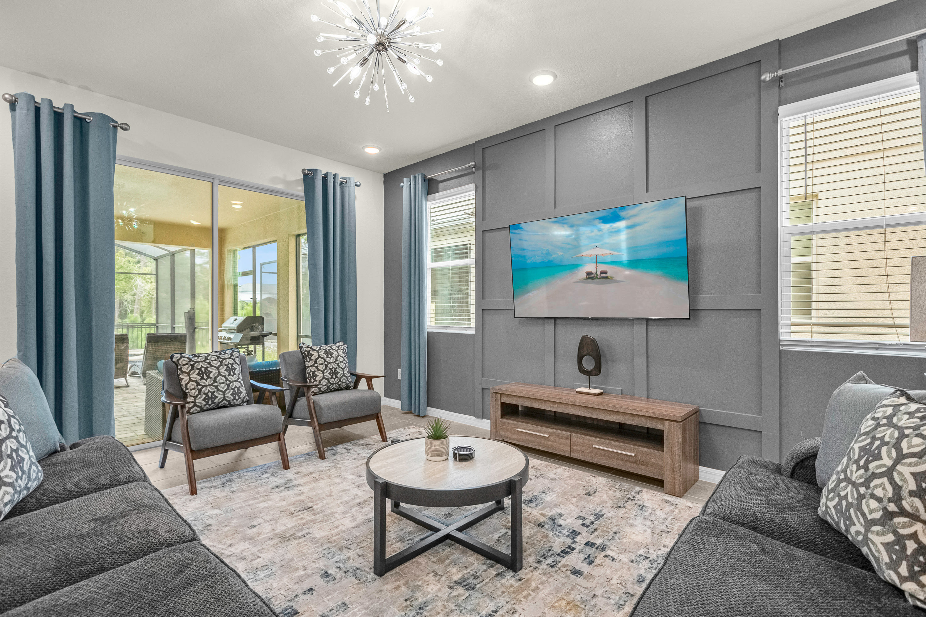 Gather In The Open Concept Living Room With A Smart TV