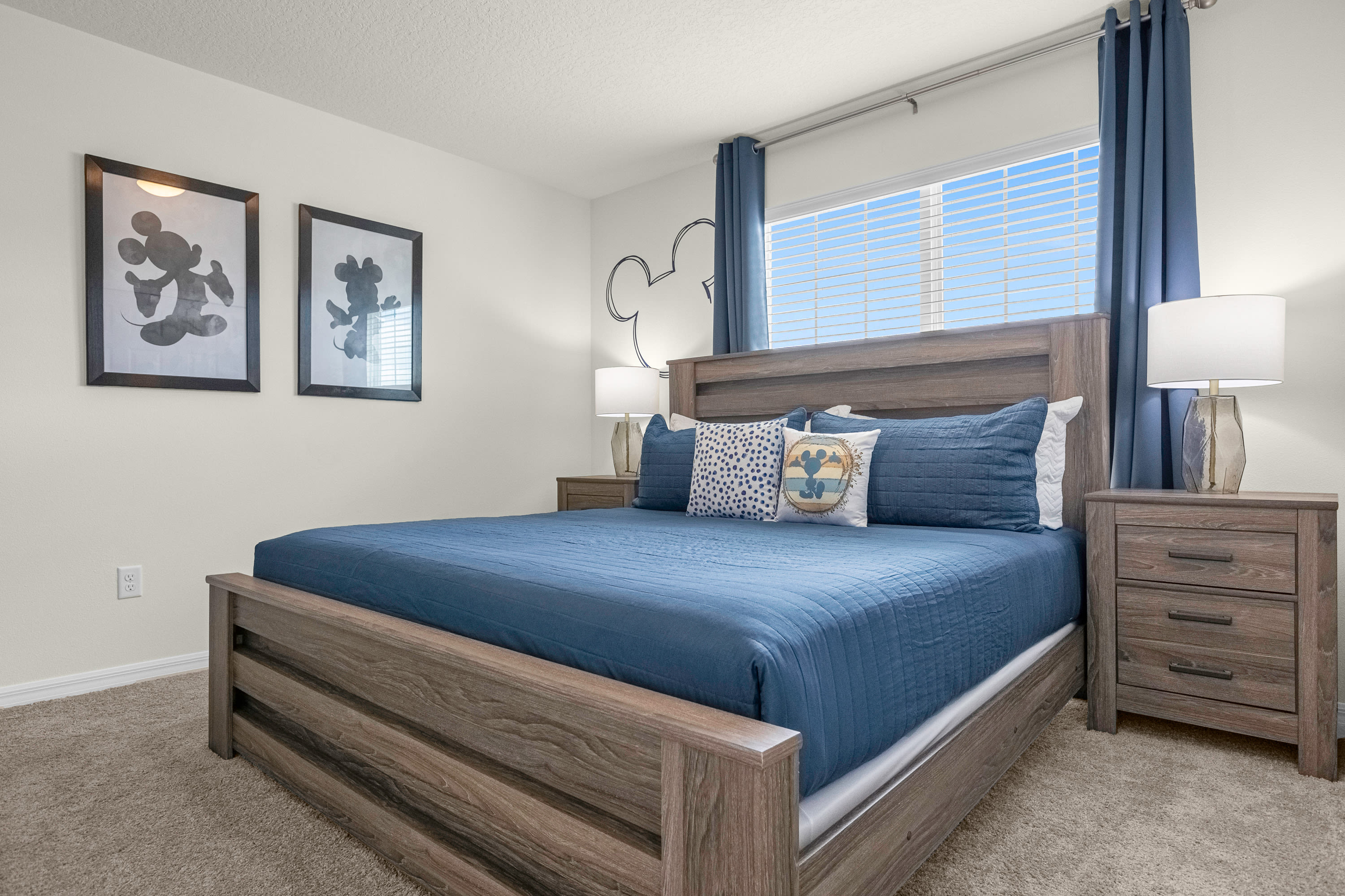 Relax In The Spacious Bedroom With Modern Blue Accents