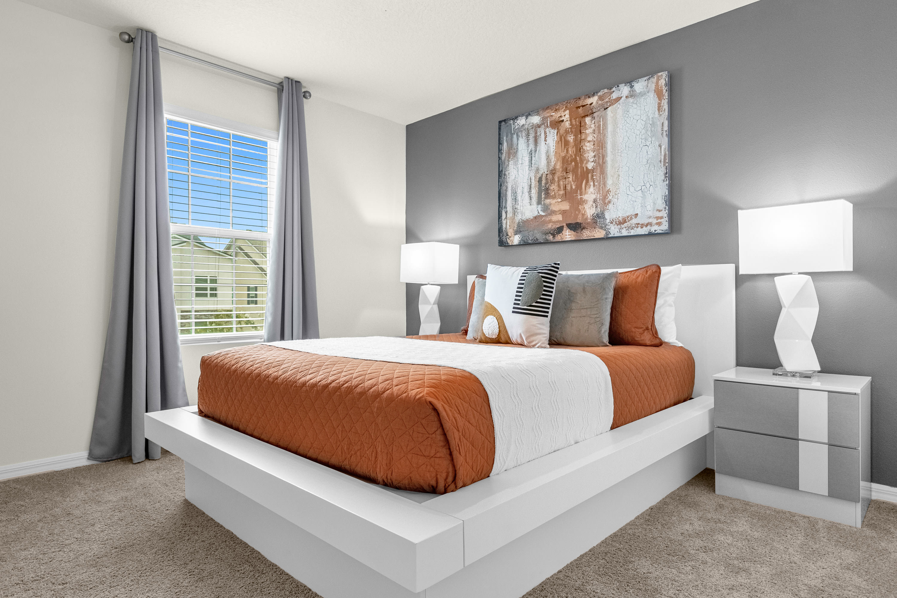 Relax In This Sophisticated Bedroom With Warm Orange Tones