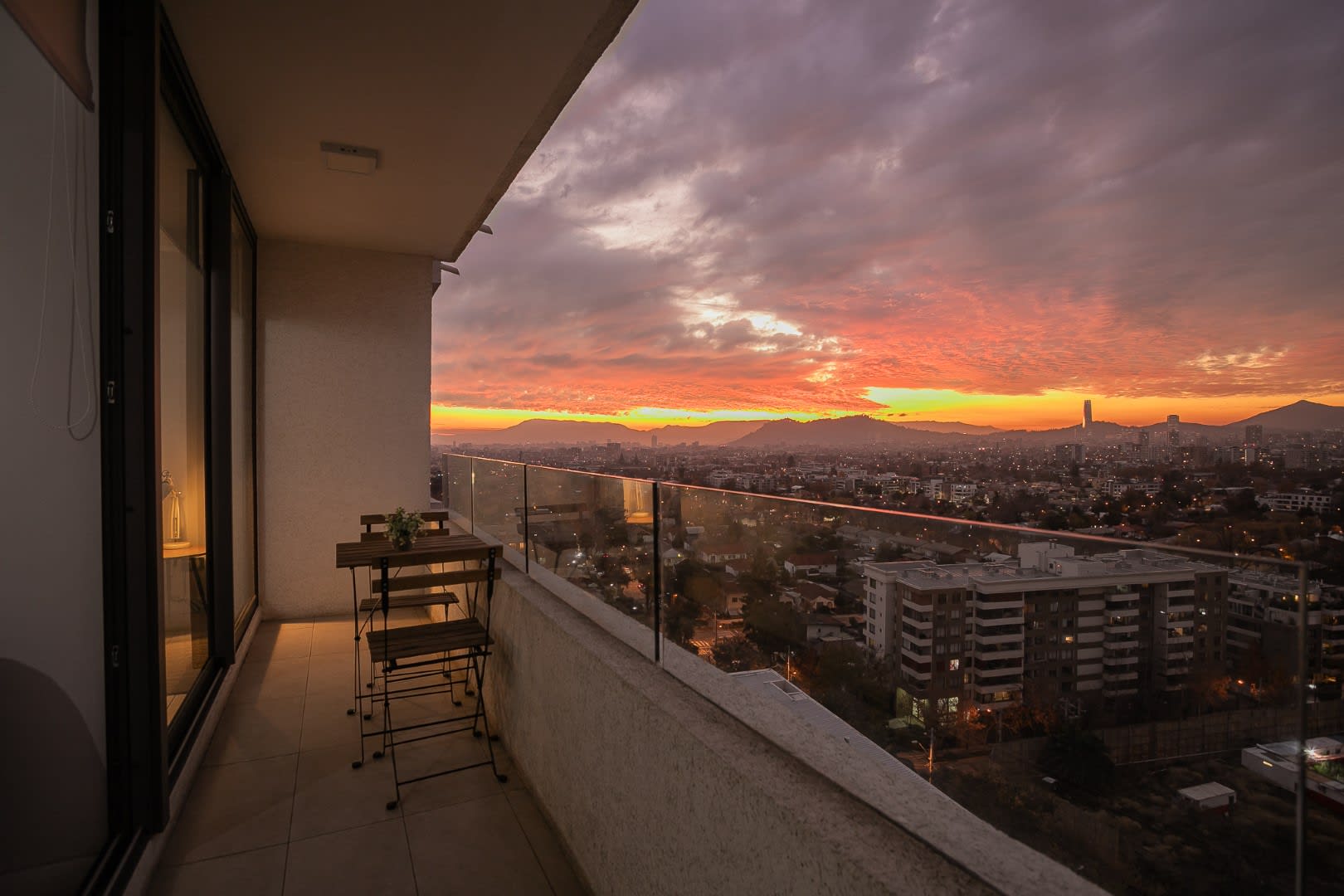Enjoy breathtaking sunset views over the city from your private balcony, perfect for a relaxing evening.