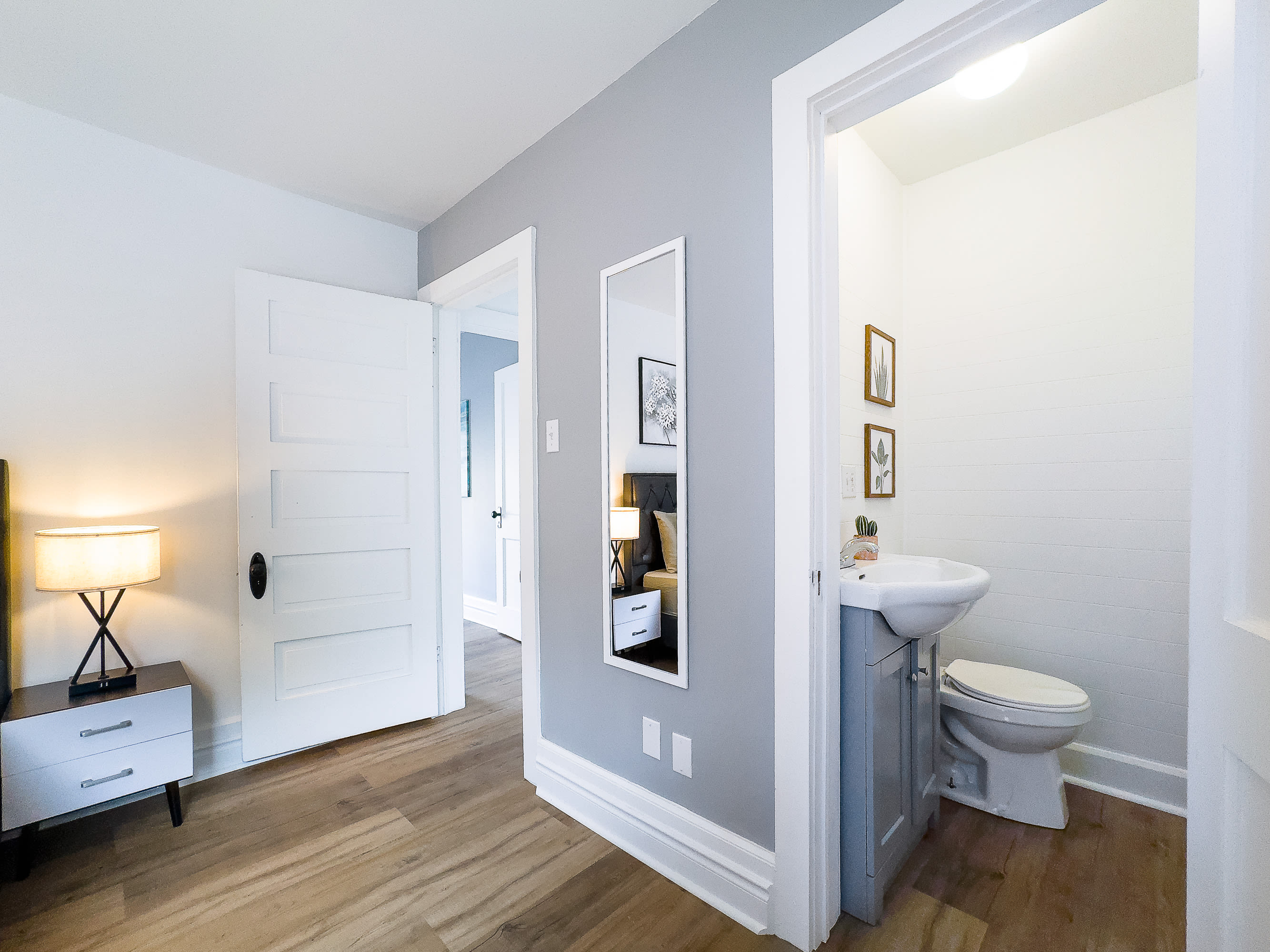 Primary Bedroom with Queen Size Bed and Half-Bathroom Ensuite