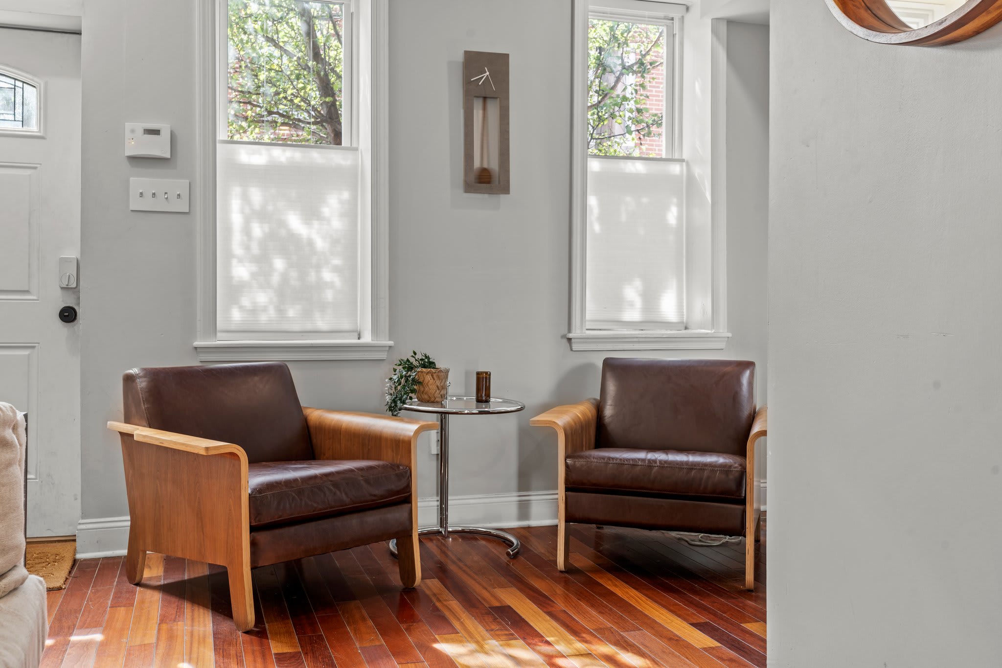Modern seating area with ample natural light provides a cozy spot to relax or read a book.
