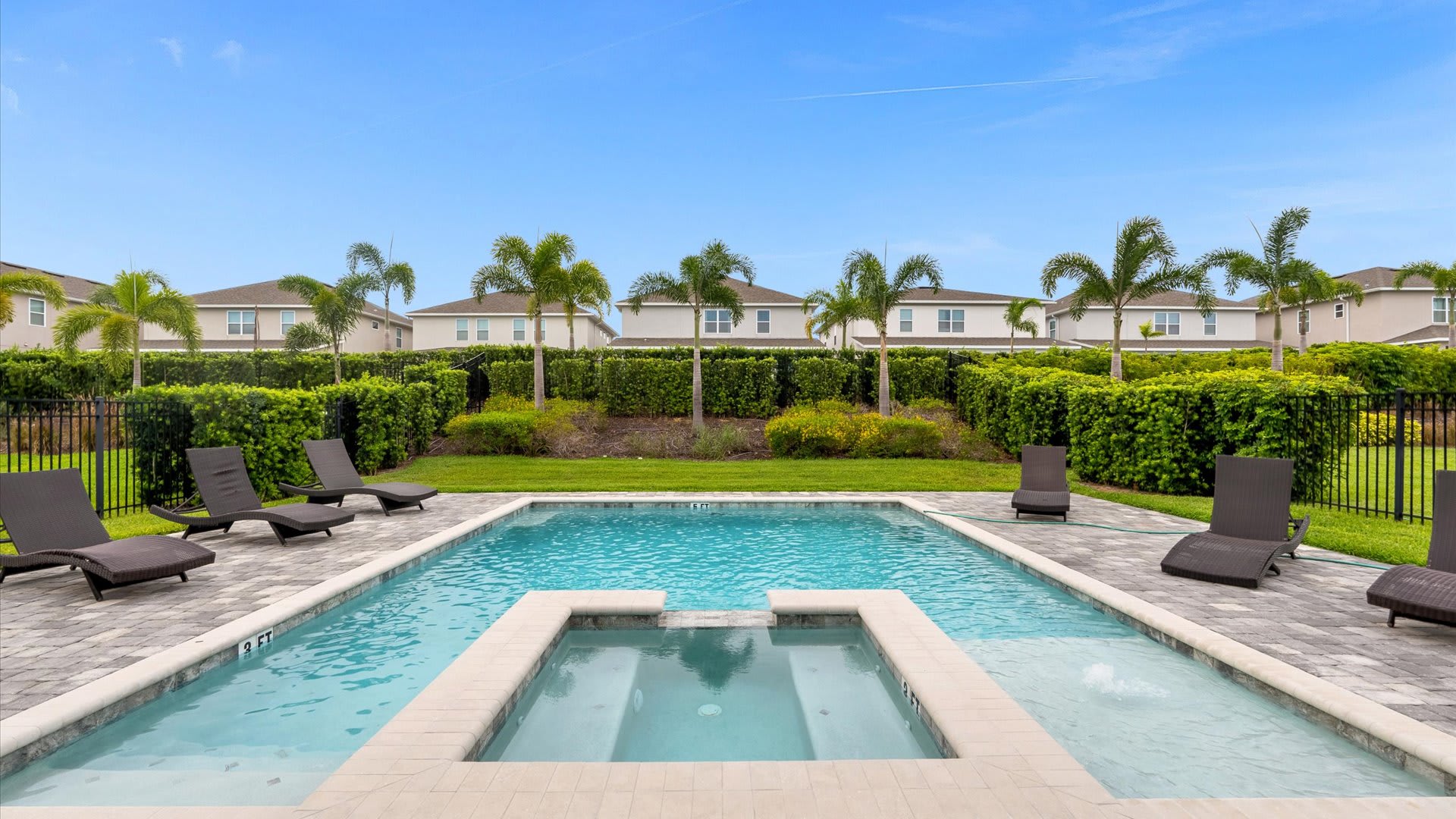 Dive into relaxation with your private pool and spa, surrounded by lush greenery and plenty of lounge space for soaking up the sun.