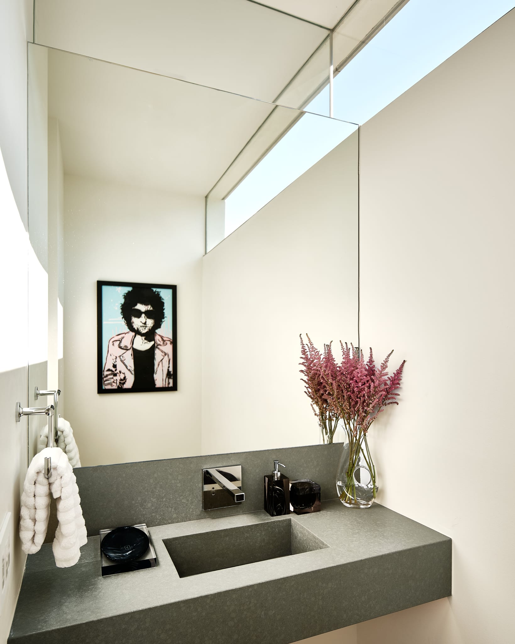 Stylish powder room featuring high-end fixtures and sophisticated design.