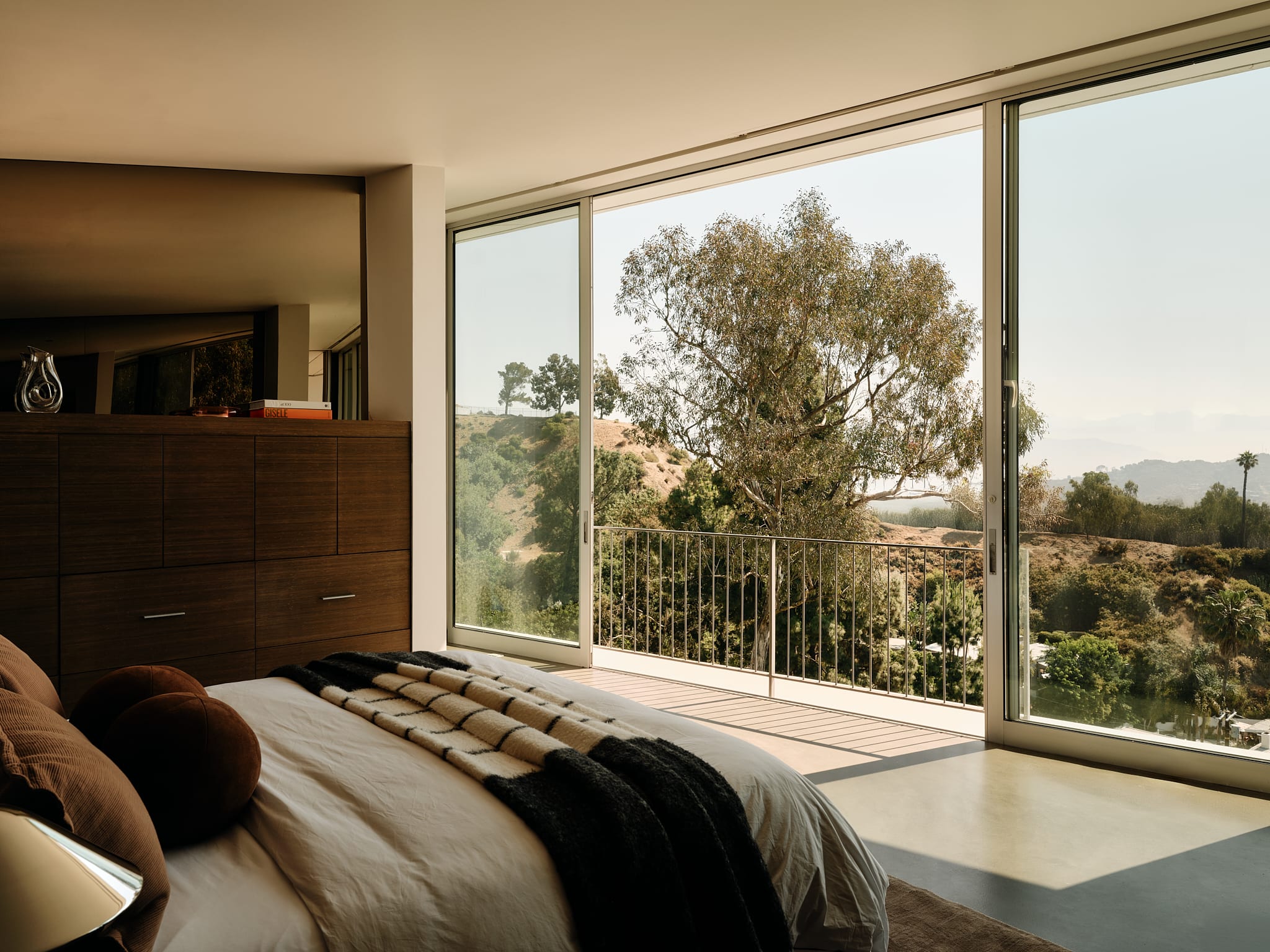 Spacious bedroom with Egyptian cotton linens and designer furniture.