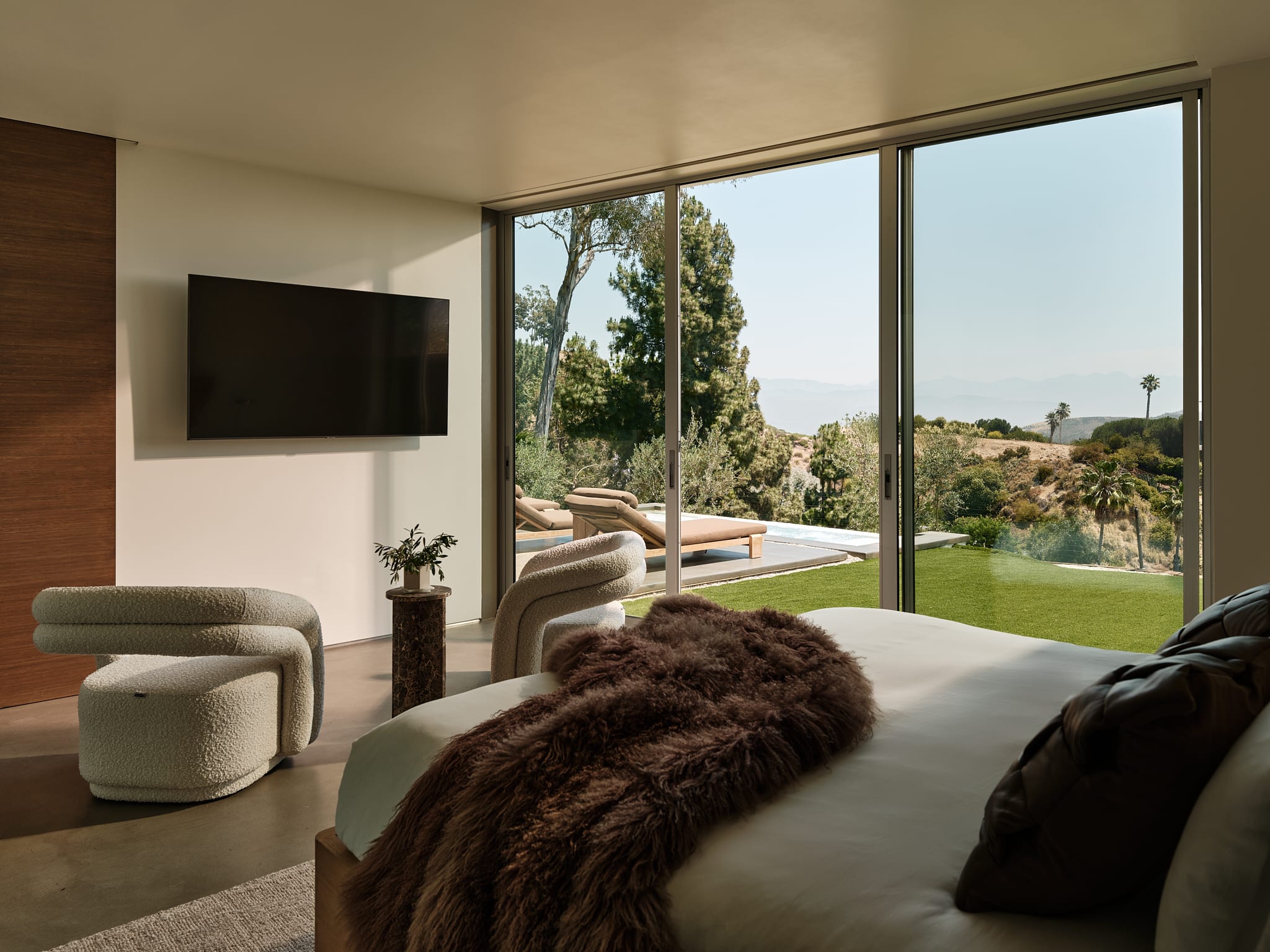 Elegantly designed bedrooms with custom RH Modern furniture and luxurious finishes.