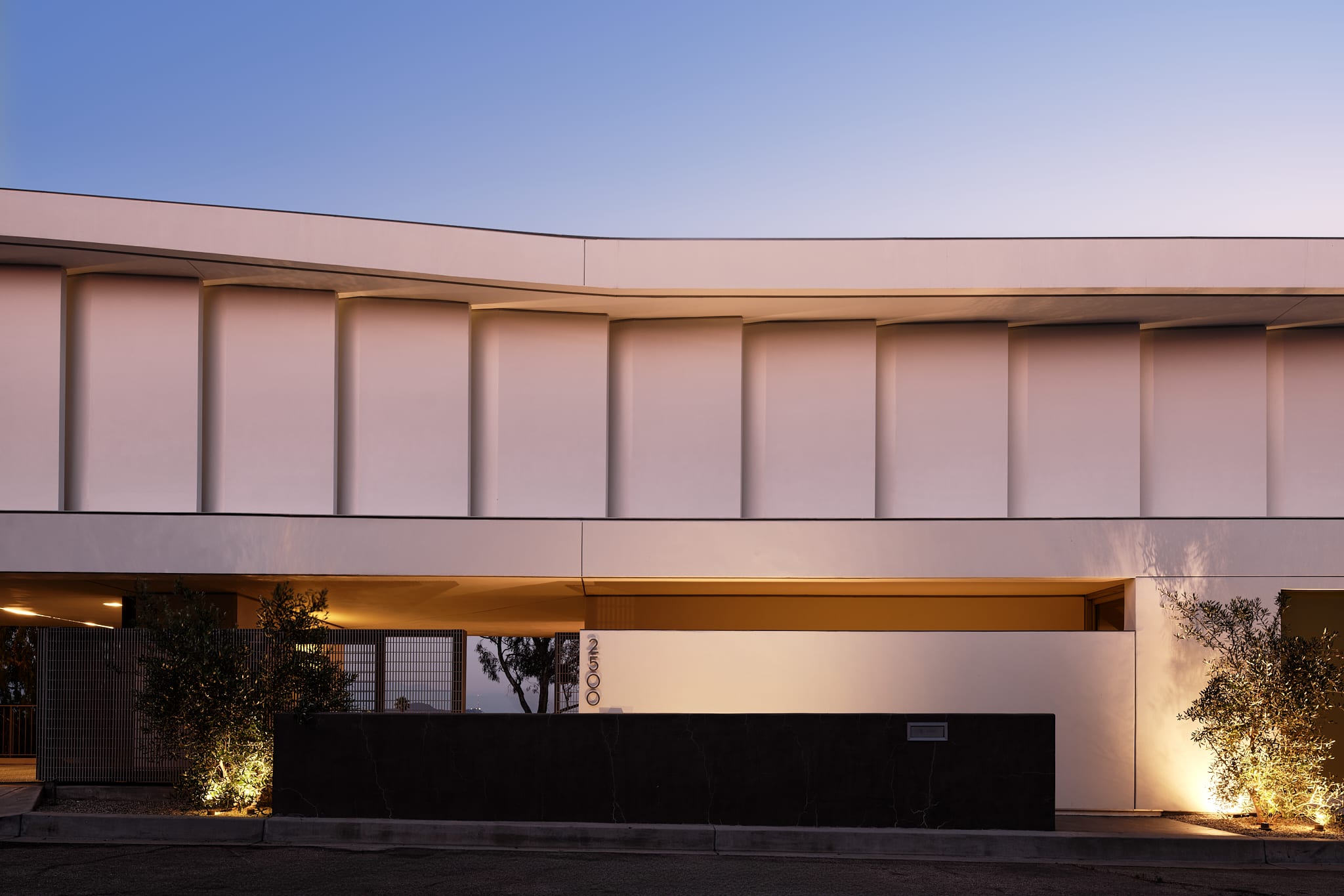 Architecturally stunning facade featuring bronzed accents and modern design elements.