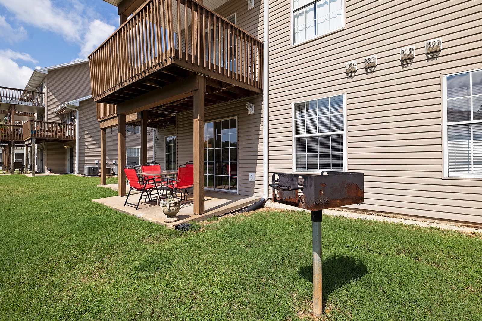 Covered outdoor patio with charcoal grill