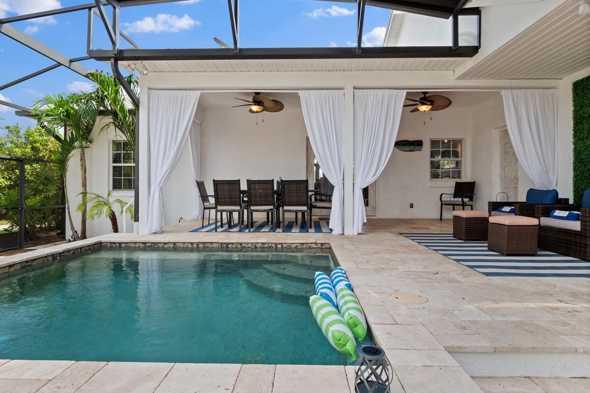 Palm Coast Retreat with Heated Pool and Golf Cart