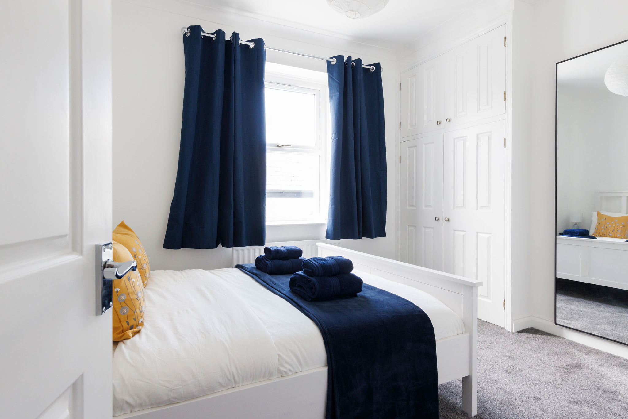 The master bedroom has a comfy king bed and plenty of space for your belongings.