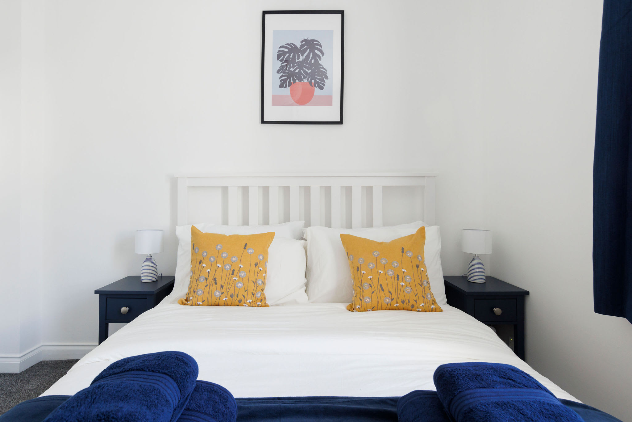 Retreat to the king bedroom, where cosy bedding and calming decor ensure a restful night's sleep.