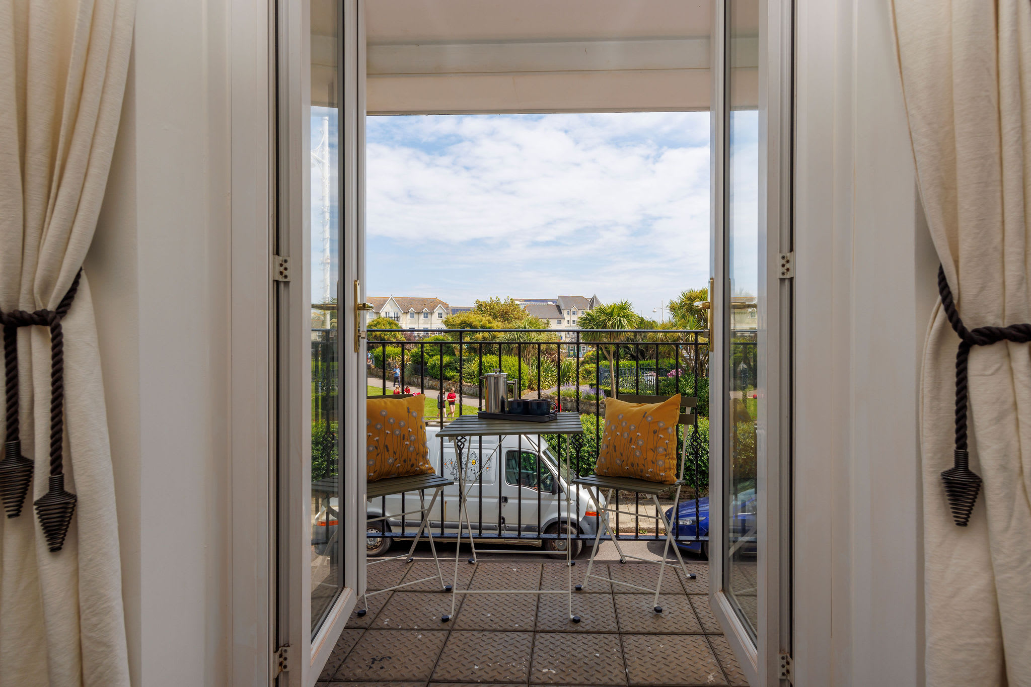 Open up the. balcony doors and let the sea breeze in.