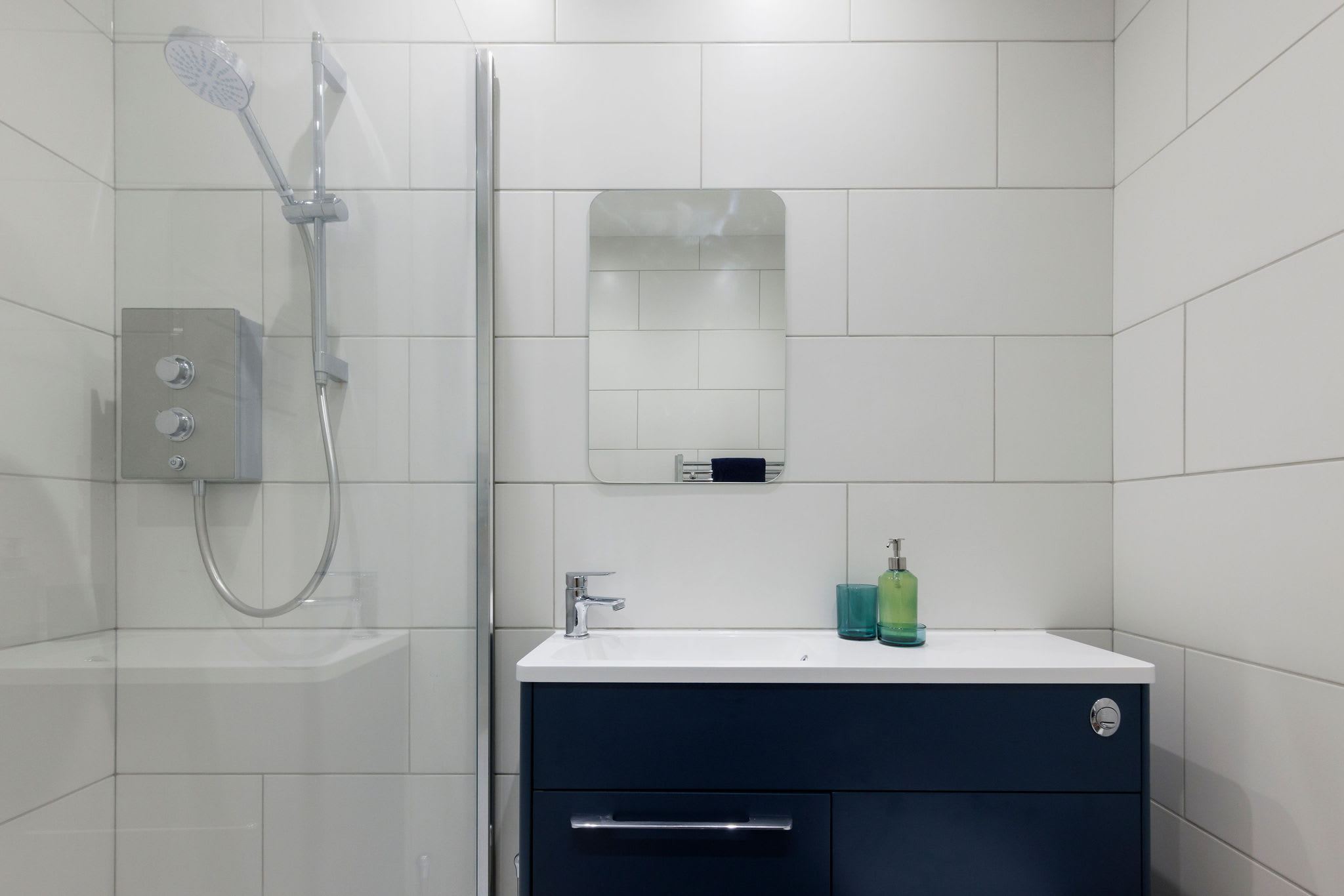 The apartment has a compact but functional bathroom.