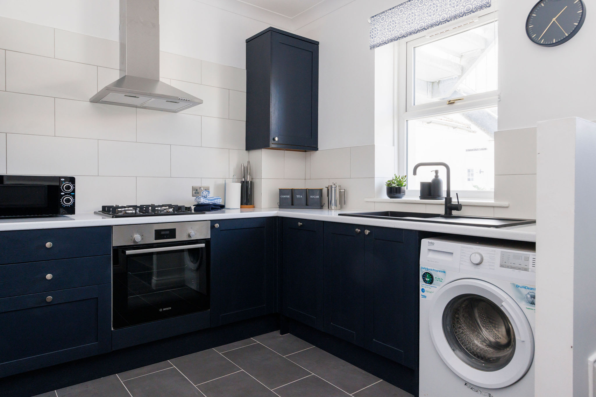 Enjoy preparing meals in the fully equipped kitchen. There is also a washing machine to keep on top of holiday laundry!