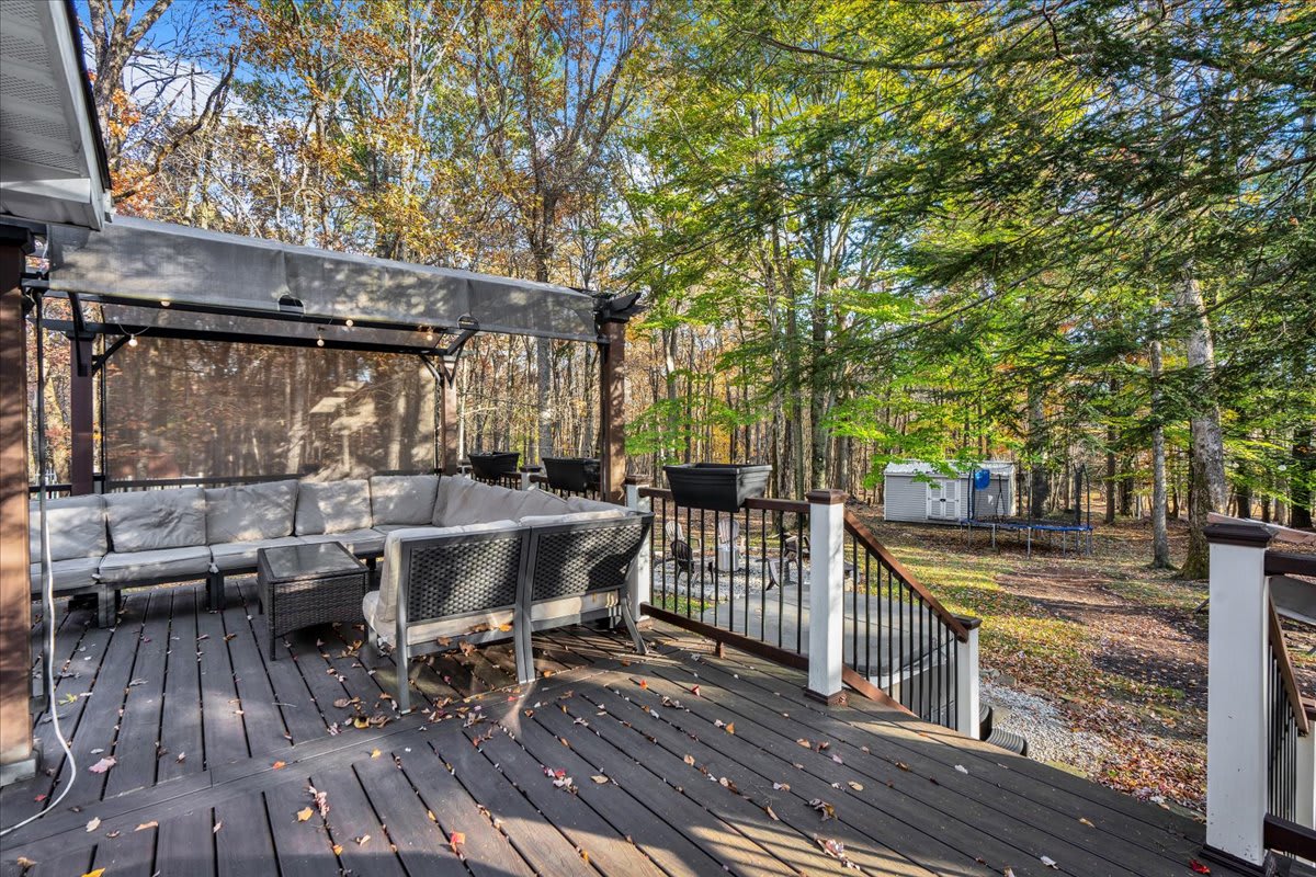 The surrounding trees add to the peaceful, secluded feel, ideal for unwinding and outdoor relaxation.