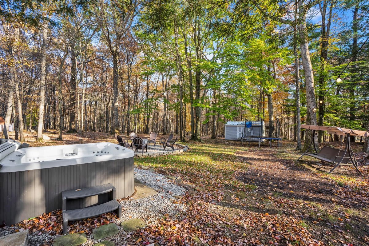 Gather around the firepit or lounge under the covered deck for a peaceful evening outdoors. This space is designed for making memories, from morning coffee to late-night storytelling.