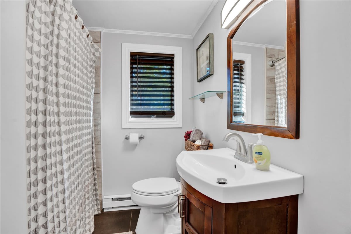 A bright and stylish bathroom with sleek fixtures, a refreshing shower, and all the essentials to start your day feeling your best.