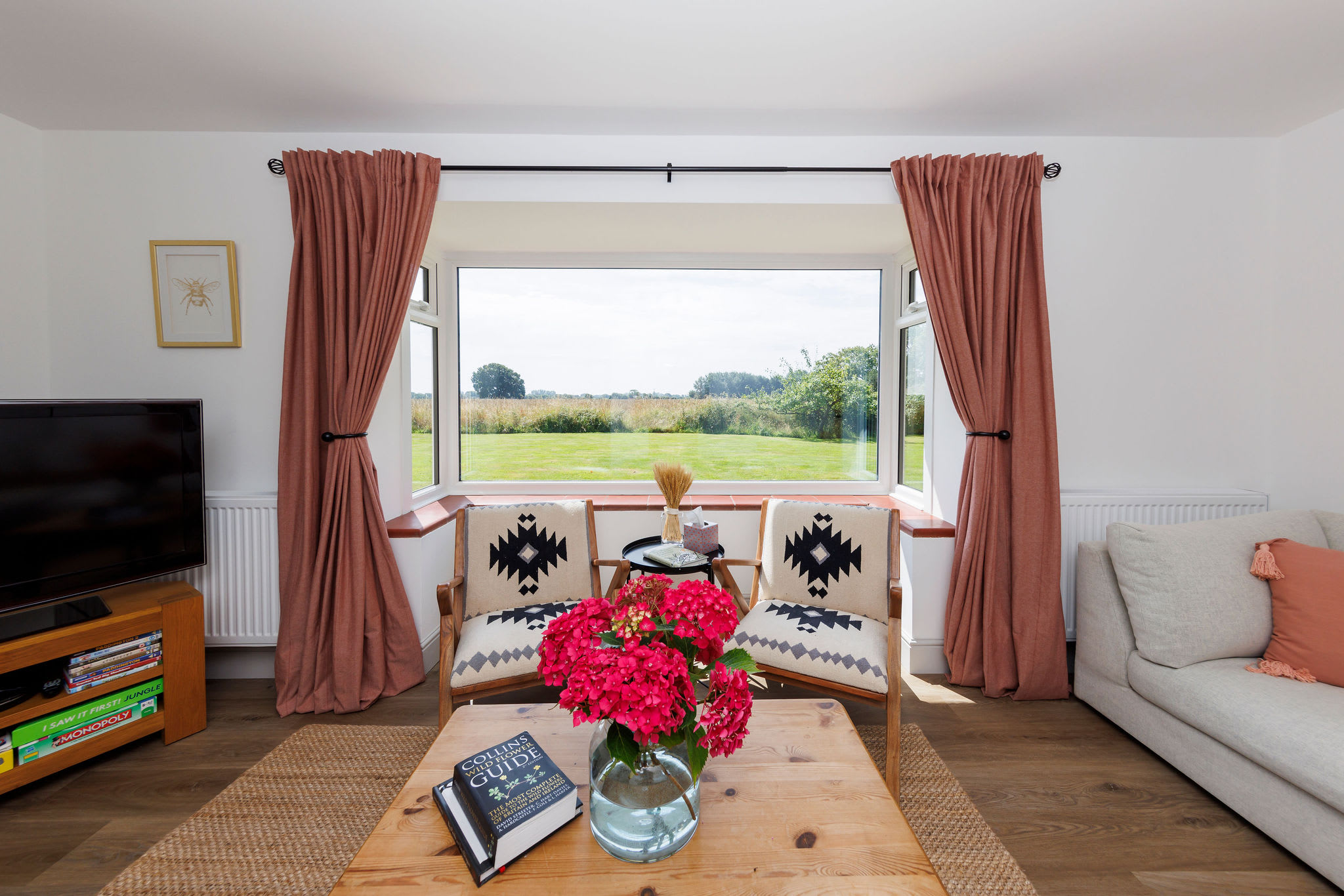 Snuggle up with a book and enjoy the scenic views from our comfy living space