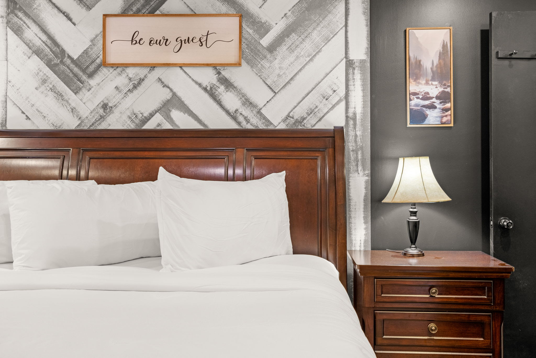 Tranquil Sleep Retreat – A peaceful bedroom with a charming wood-paneled feature wall, cozy lighting, and a soft color palette for restful nights.