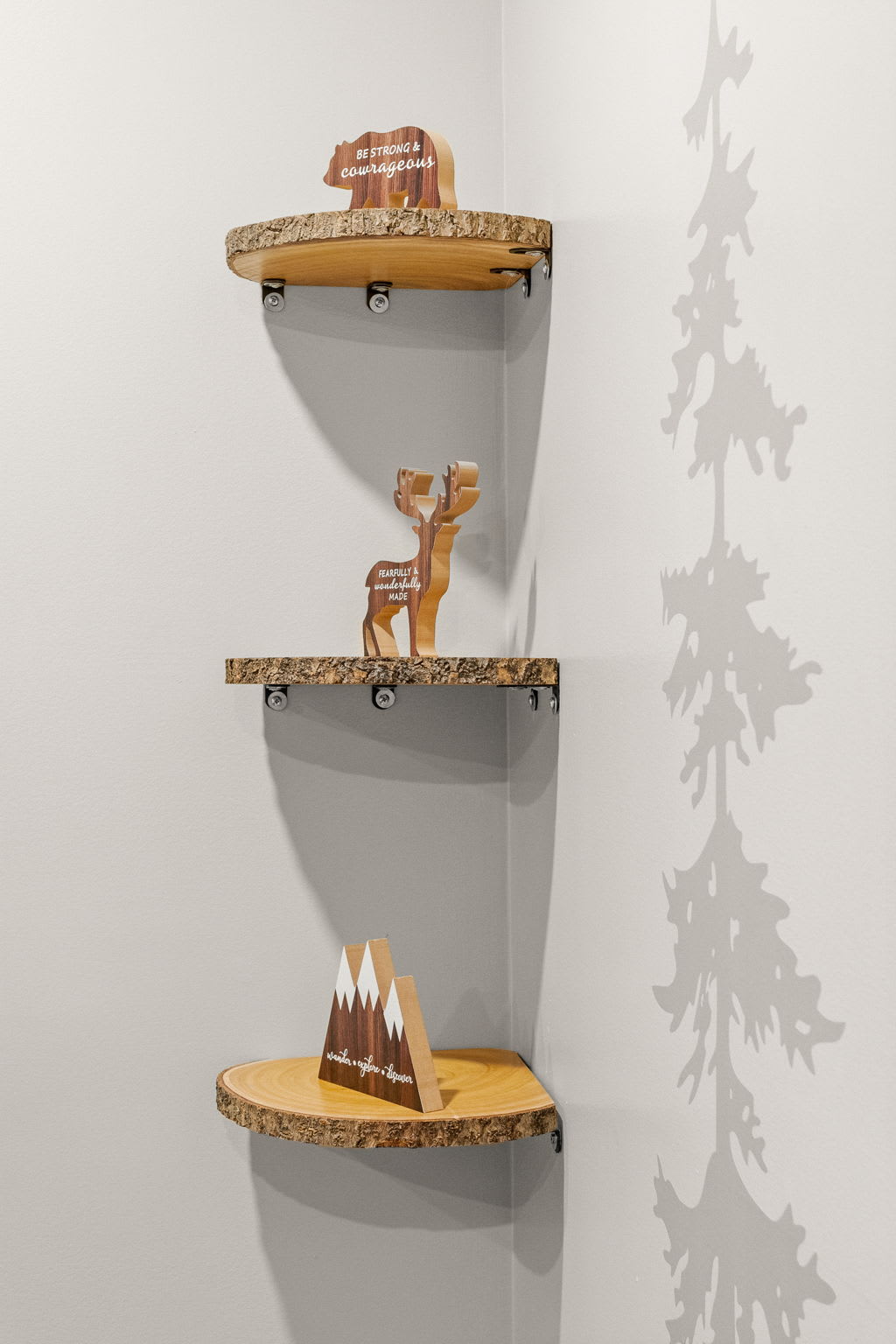 Beautifully designed wooden shelves with small decorative accents, blending functionality with rustic charm.