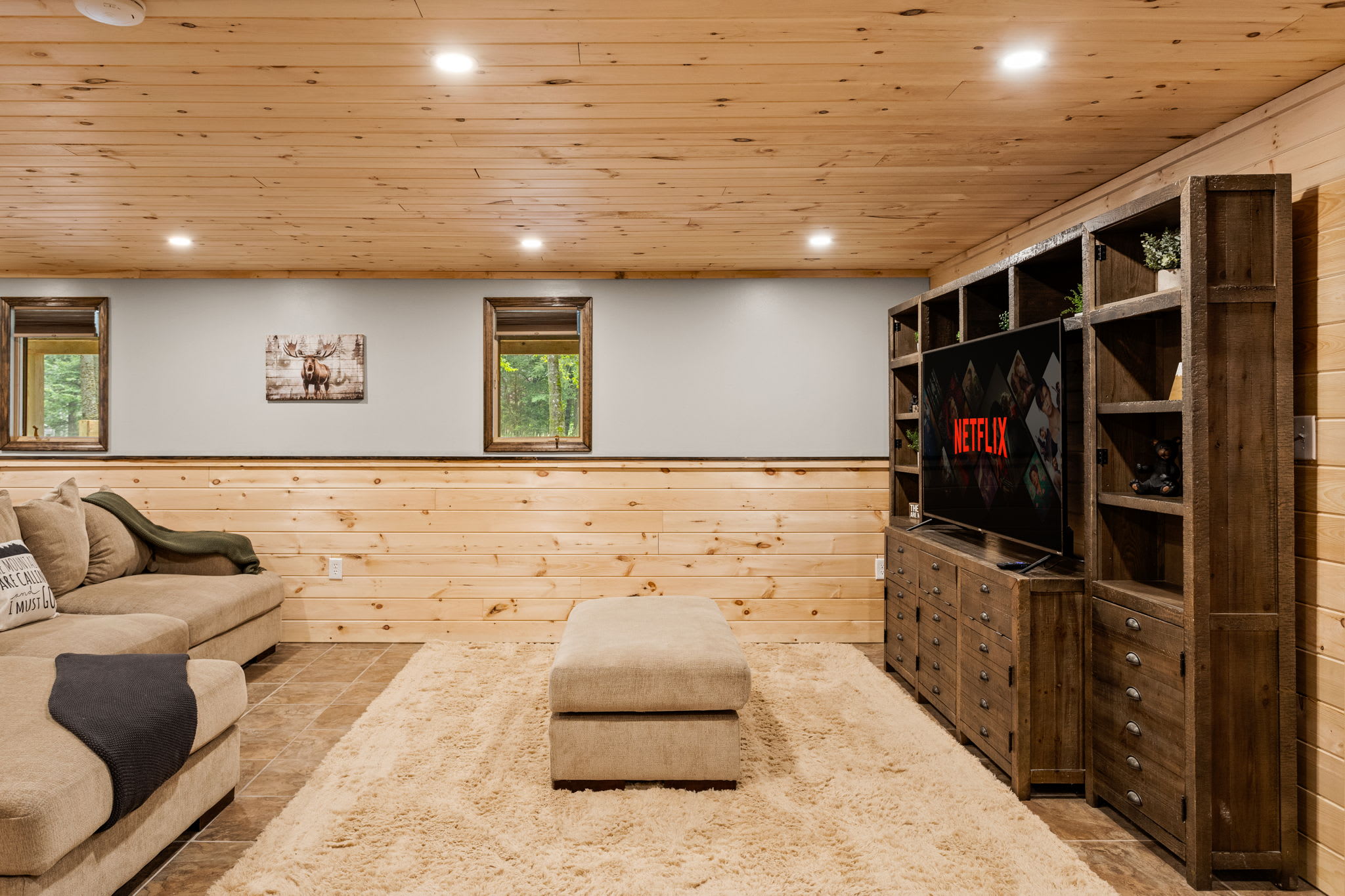 A beautifully designed lounge with soft lighting, ample seating, and a cozy atmosphere for unwinding with family and friends.