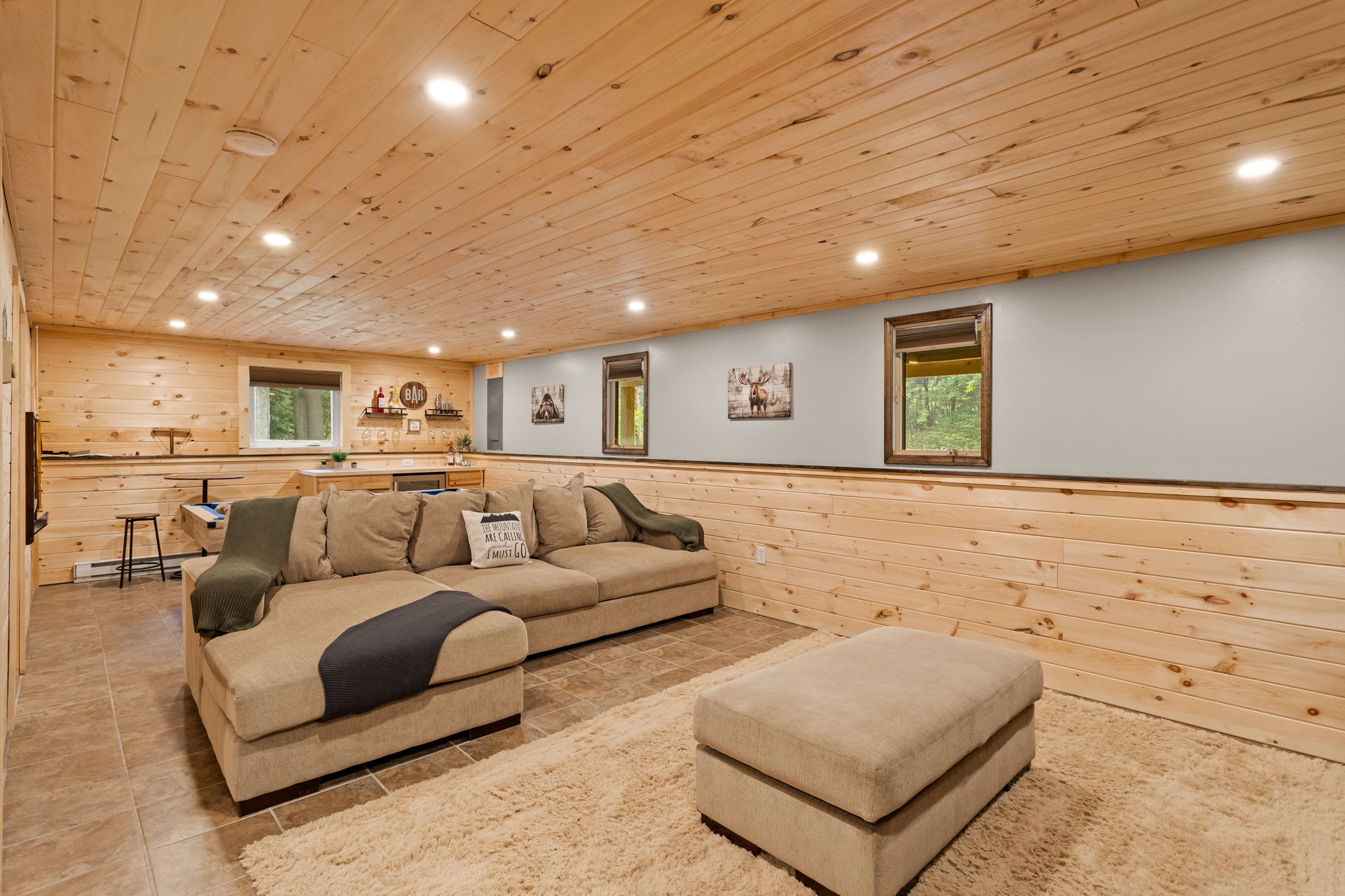 A thoughtfully designed entertainment area with soft textures, neutral tones, and a layout that invites relaxation.