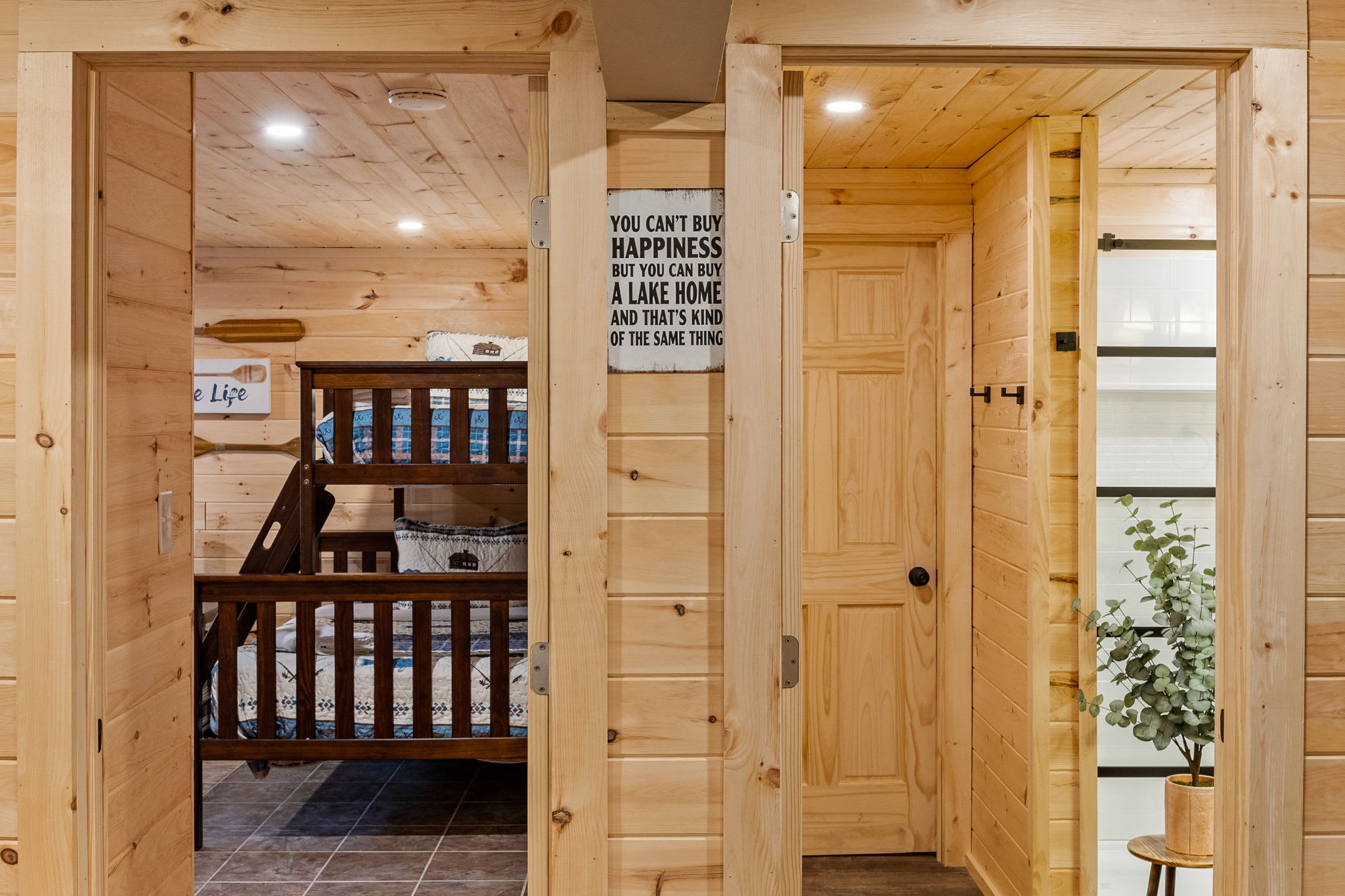 Charming Cabin Loft Vibes – A warm and inviting entryway to the bedroom, featuring rustic wooden walls, cozy lighting, and a seamless blend of style and comfort.