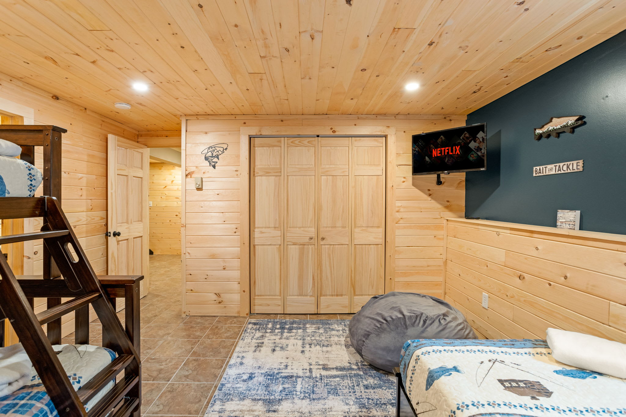 Warm & Inviting Lodge-Style Bedroom – A beautifully lit space with a blend of rustic charm and modern comforts, creating the perfect retreat.