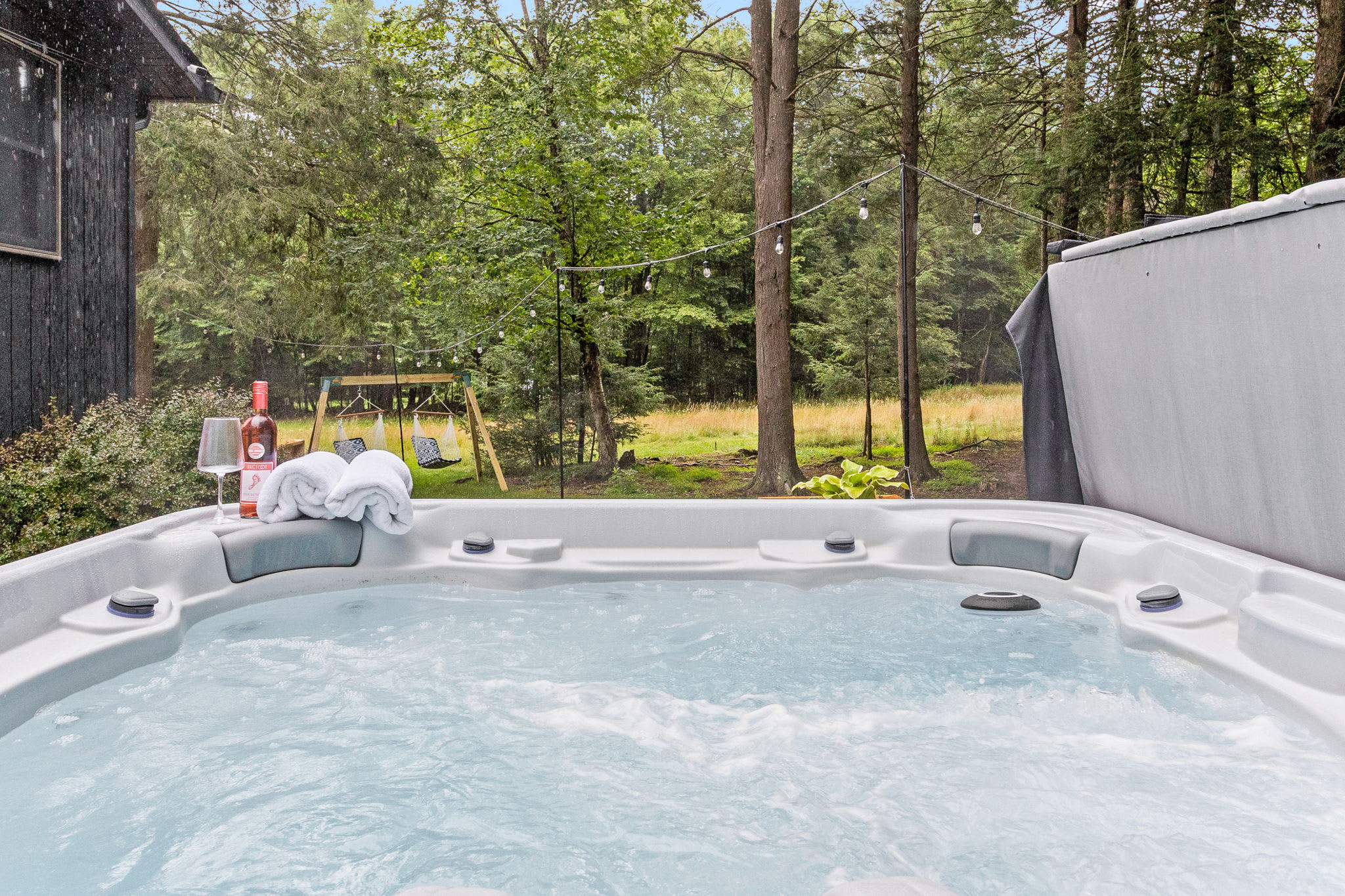 A bubbling hot tub with ergonomic seating and crystal-clear water, making it the perfect spot to soak and unwind.