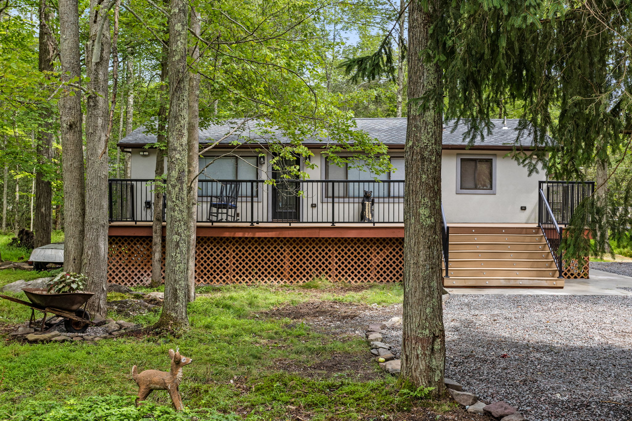 Tucked away in a lush green setting, this home offers privacy and peacefulness. Whether you're relaxing on the deck or exploring the nearby trails, you'll be immersed in nature’s beauty.
