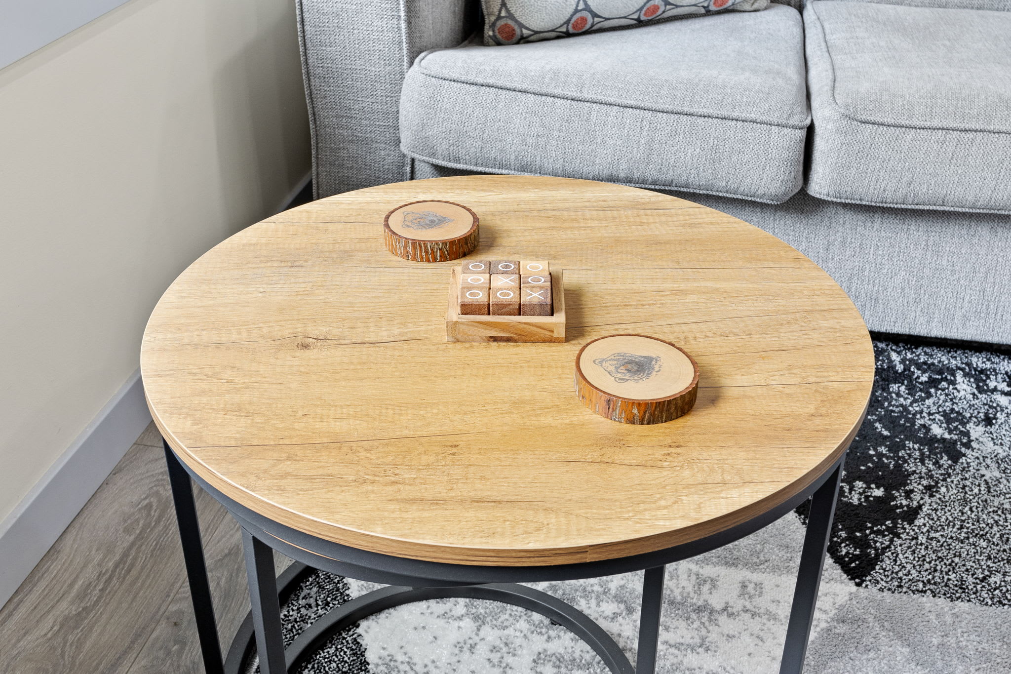 A simple yet stylish touch, this natural wood coffee table is the perfect place to set down your drink, play a game of tic-tac-toe, or just enjoy a quiet moment.