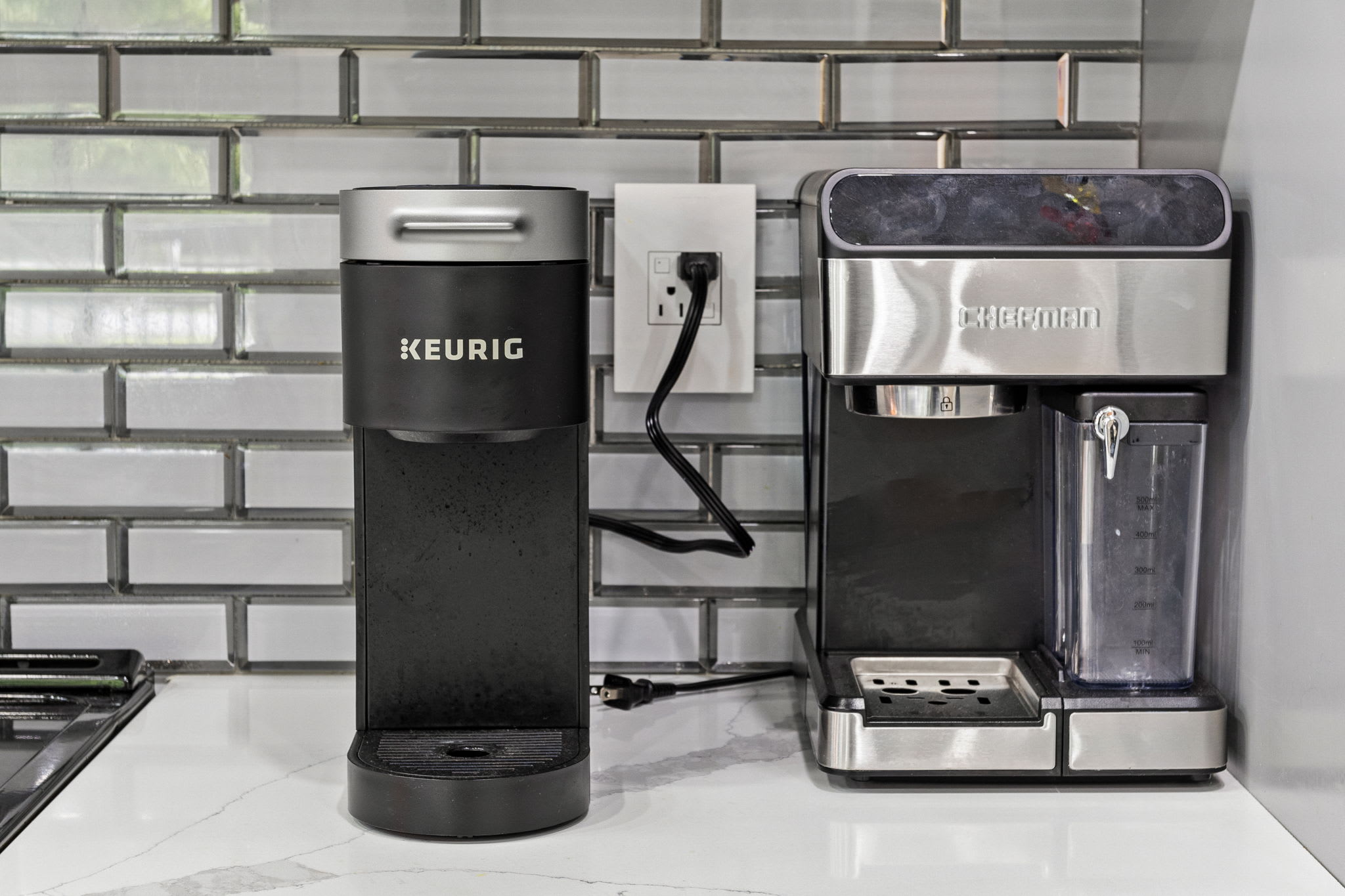 Start your day right with a Keurig and a high-quality espresso machine, ensuring you have the perfect cup of coffee for any mood. Conveniently set up on a sleek, modern countertop.