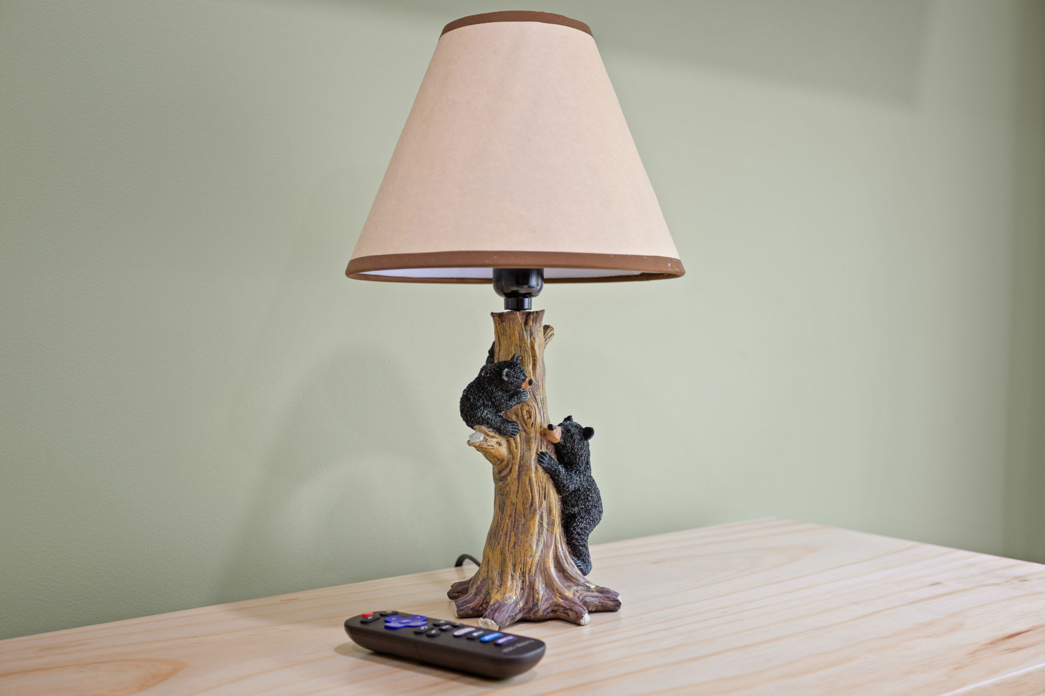 A rustic touch with a playful twist this bear-themed lamp adds character and warmth to the room, complementing the cabin-style decor.